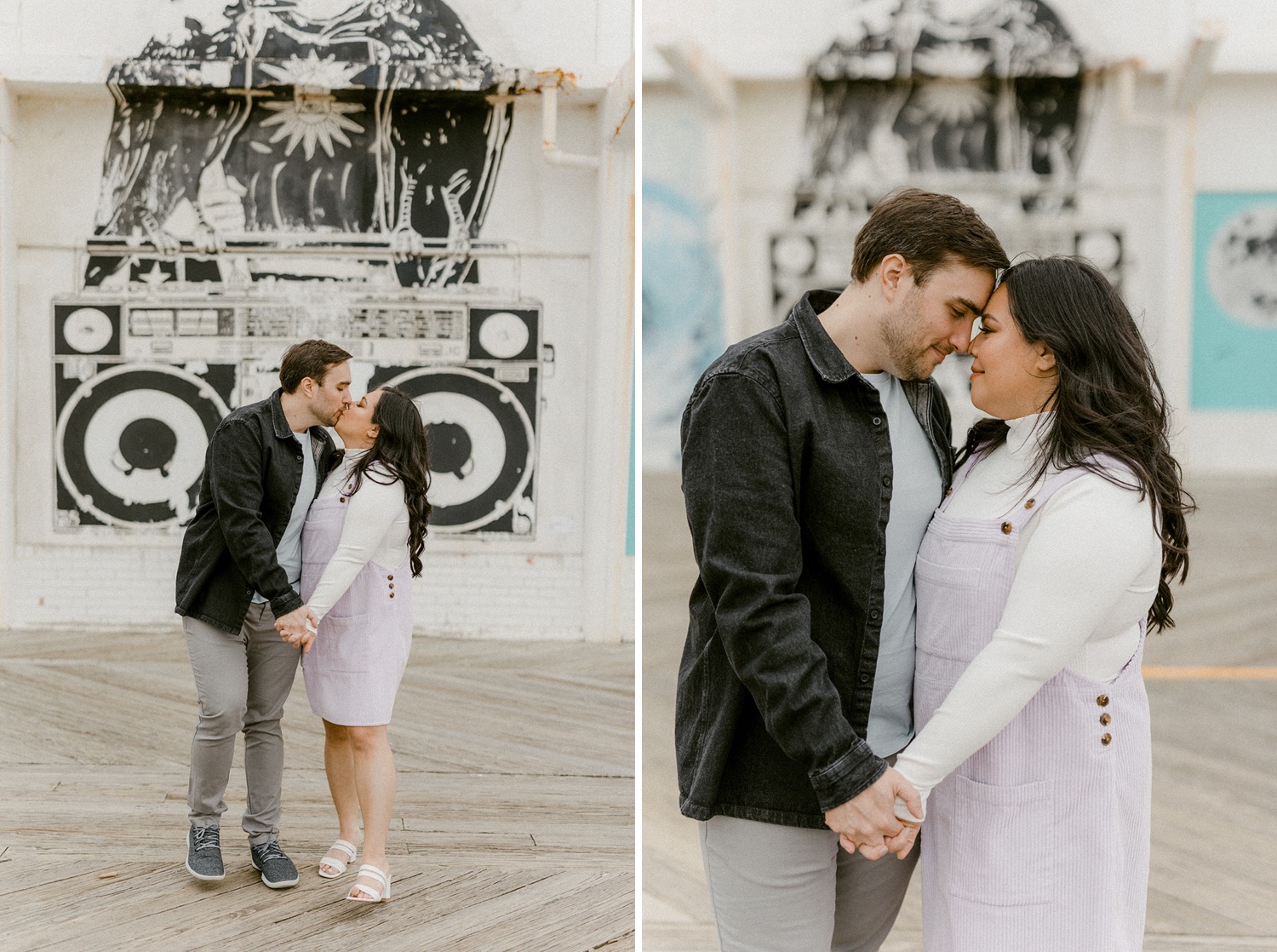 couple intimate moment kissing on boardwalk with stereo mural