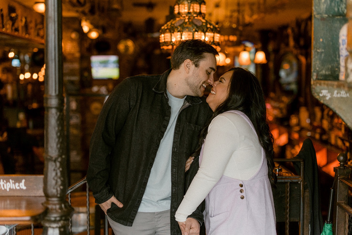 couple kissing in eccentric eclectic bar