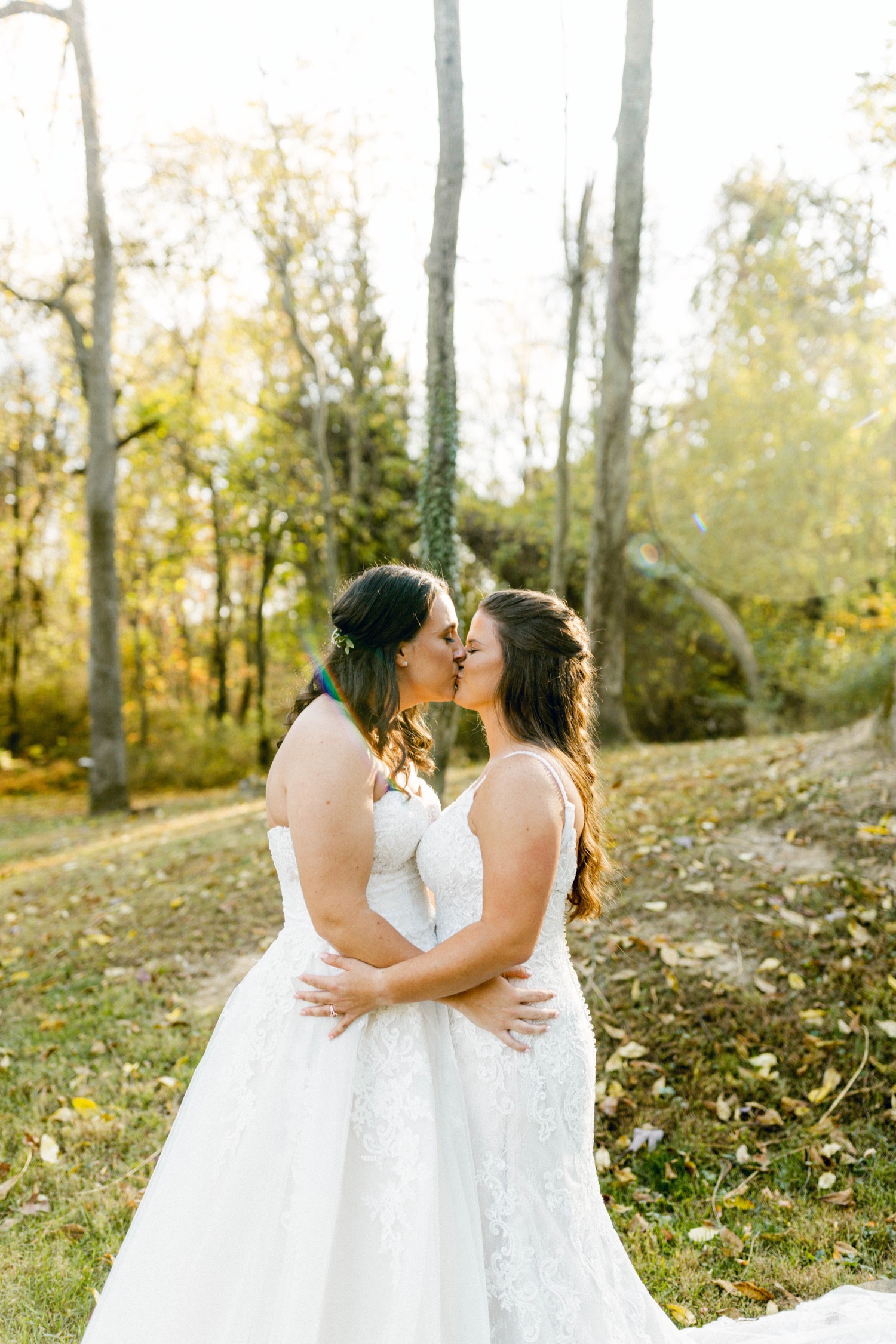 outdoor woodsy fall wedding first kiss brides