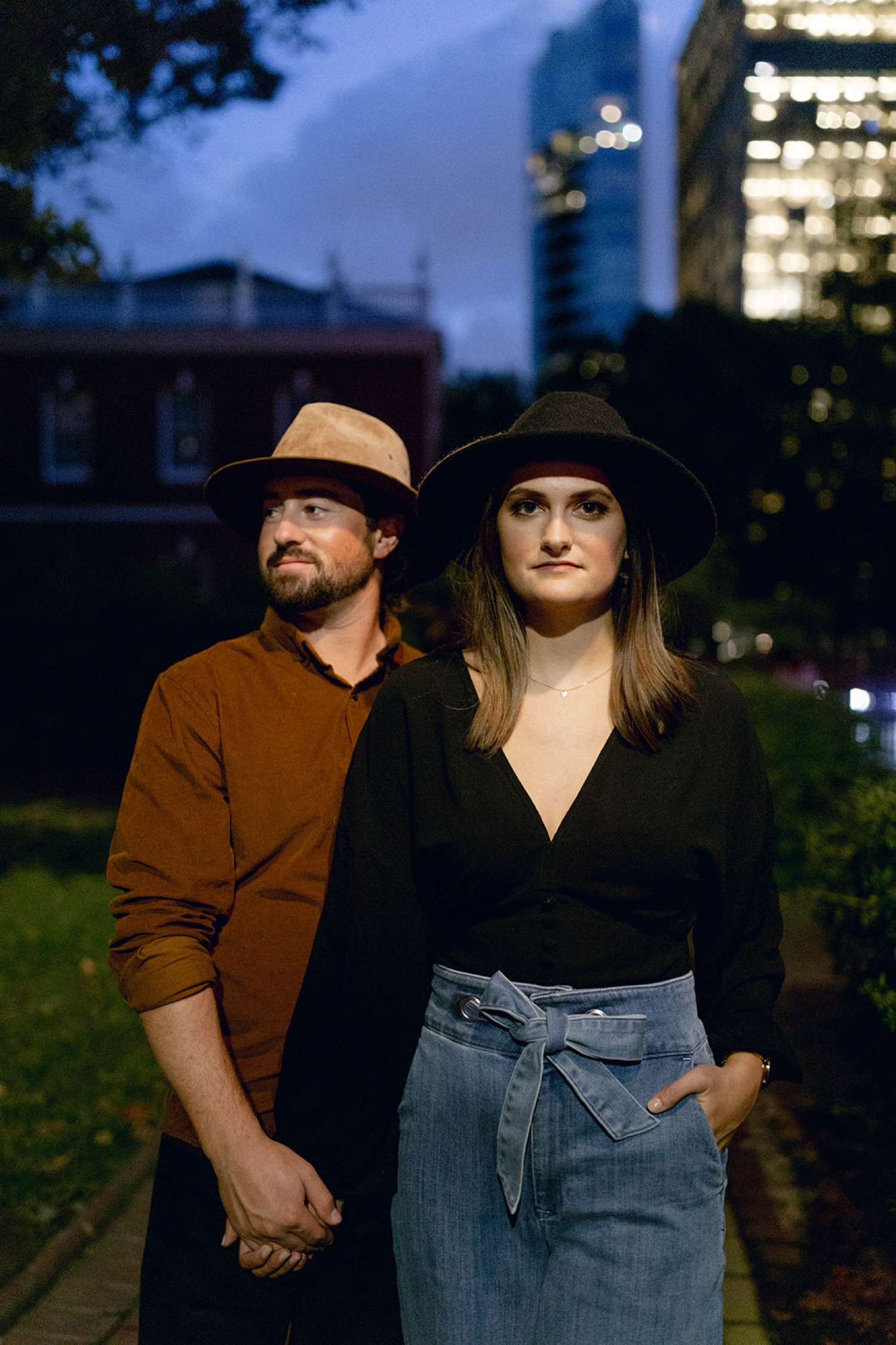 serious couple engagement photo with hats