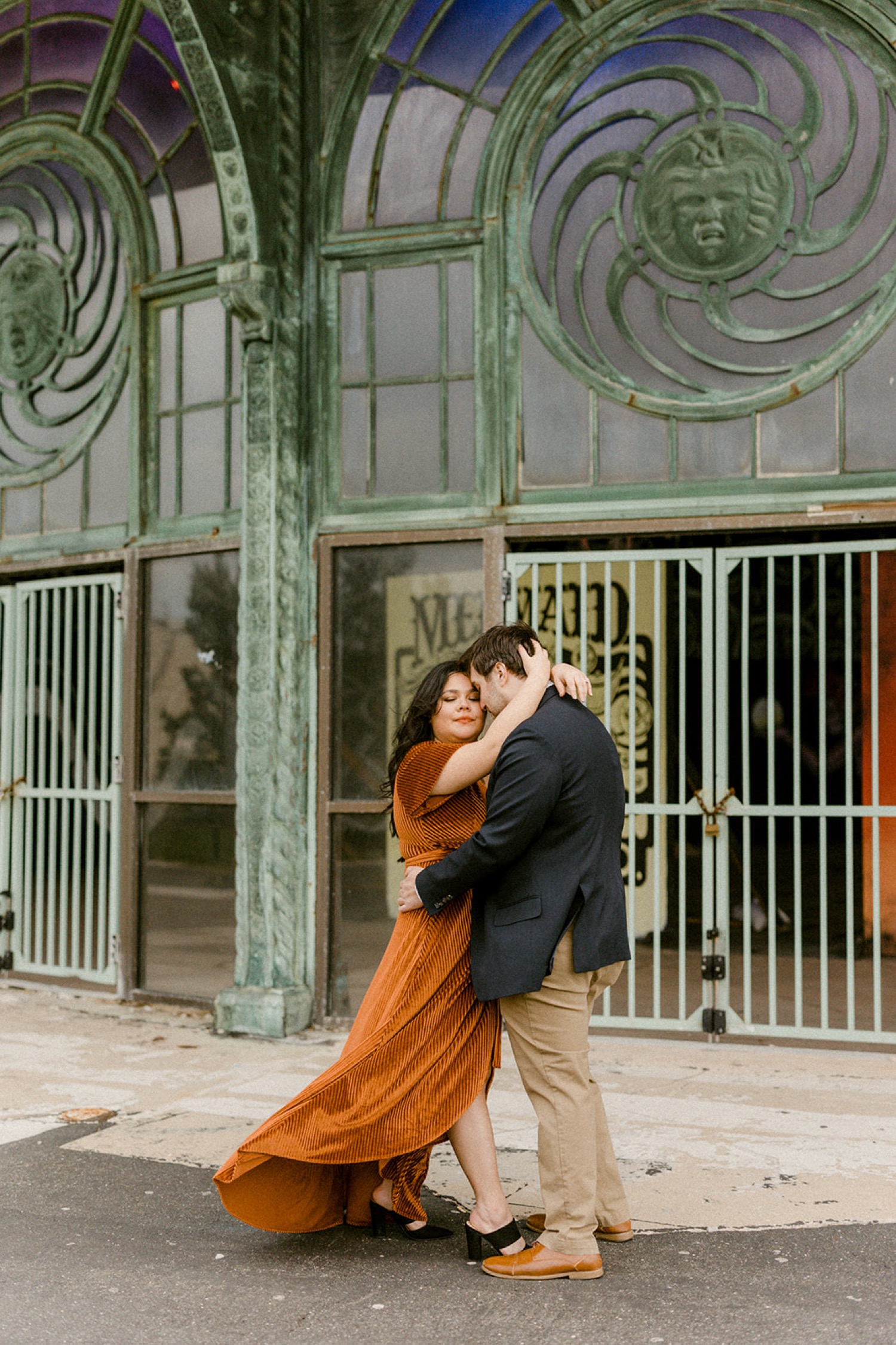 couple embracing dress blowing in the wind