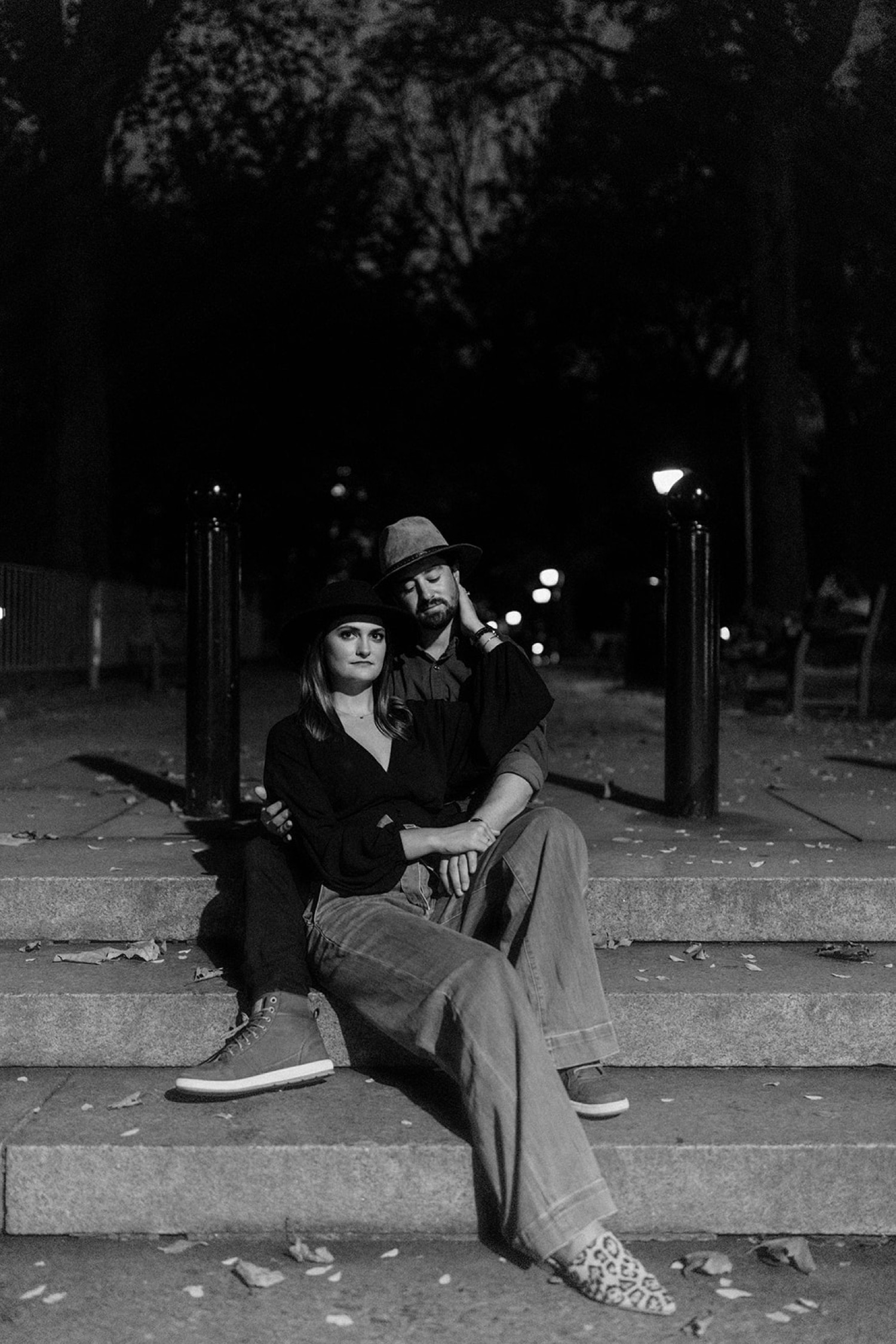 couple sitting on stairs in city park