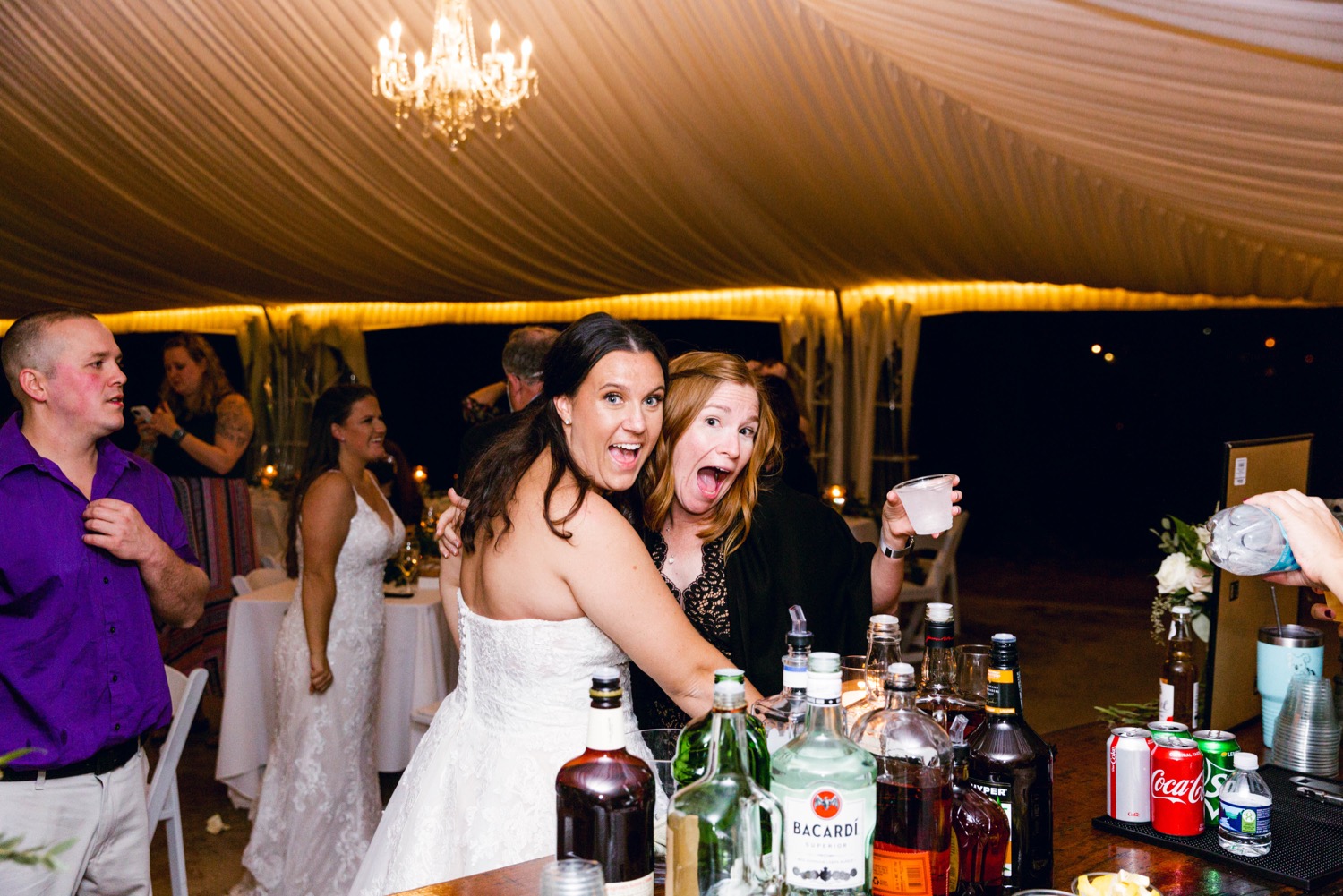 bride and guest at bar wedding reception