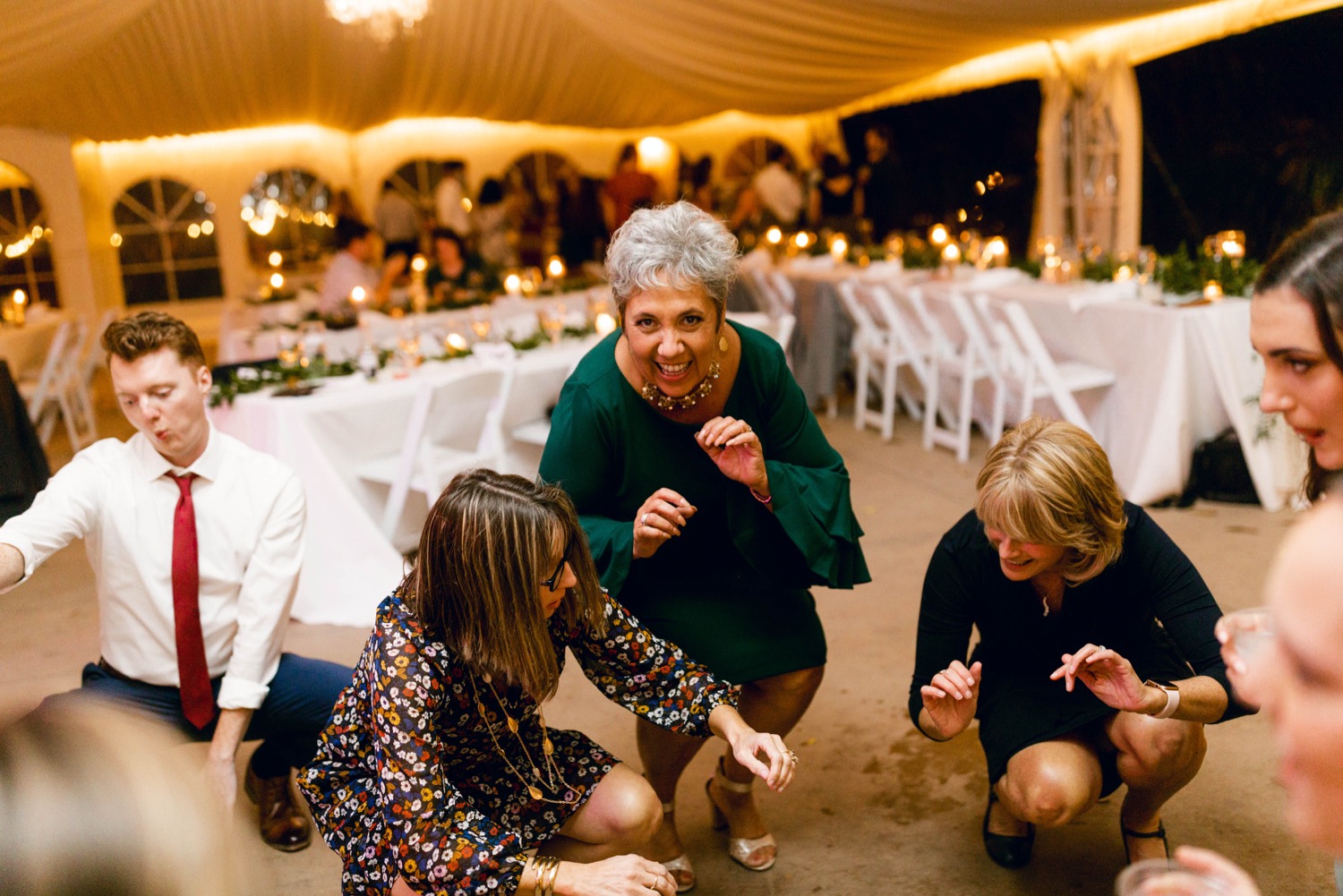 guests getting low dancing at wedding reception