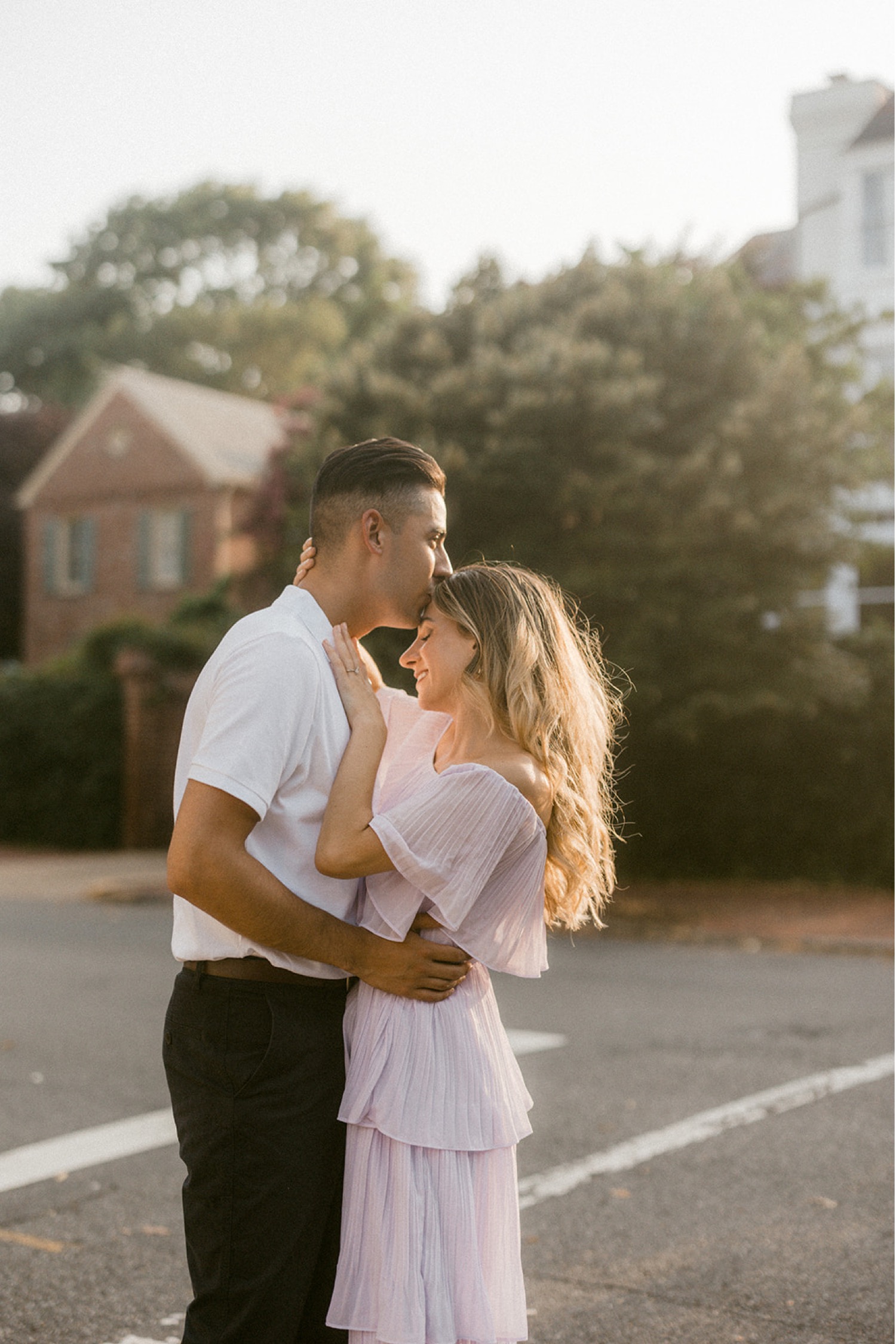 couple kiss on forehead timeless engagement session