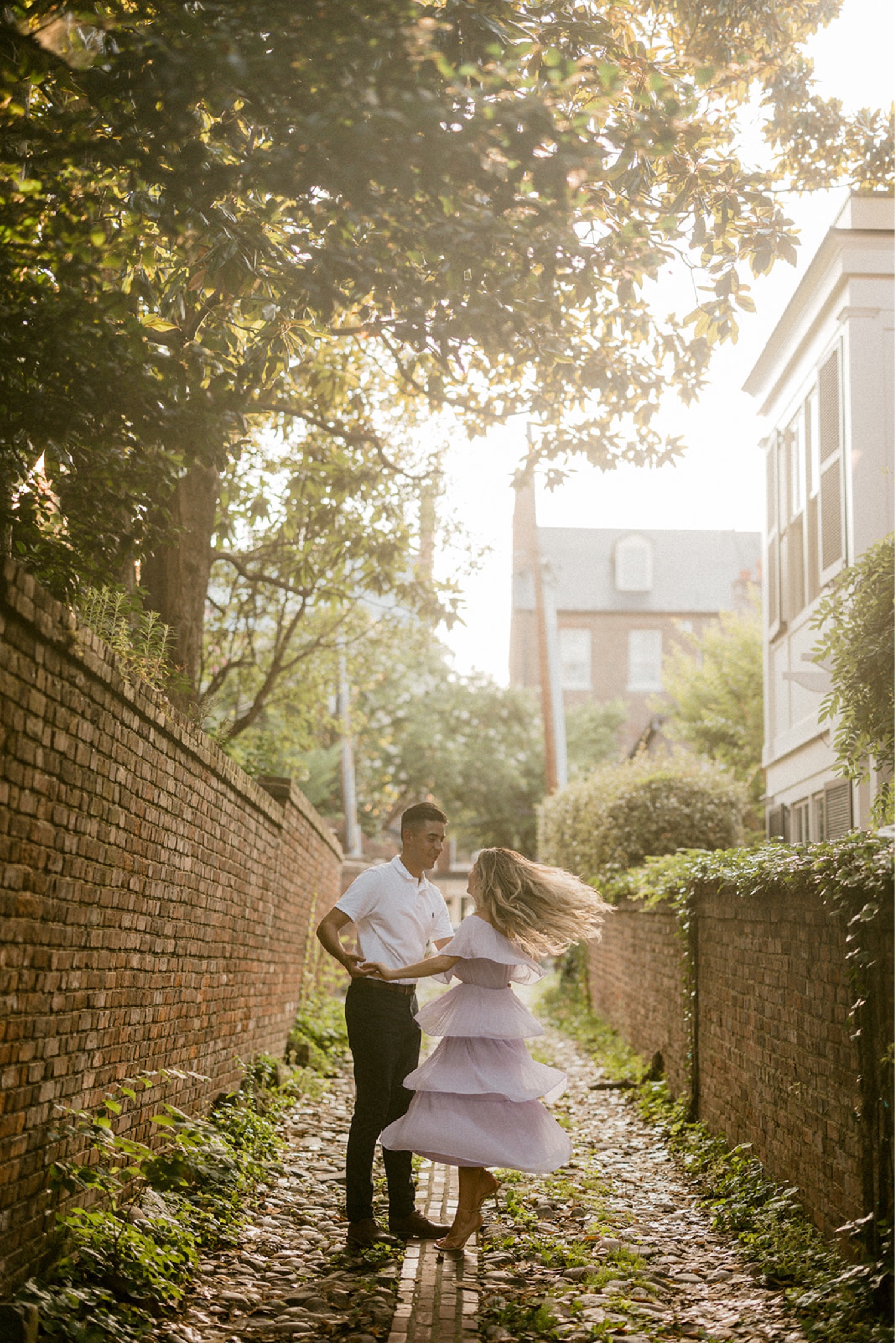 couple dancing in charming brick alley