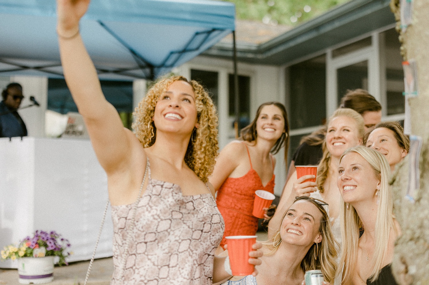 backyard micro wedding guests taking selfie