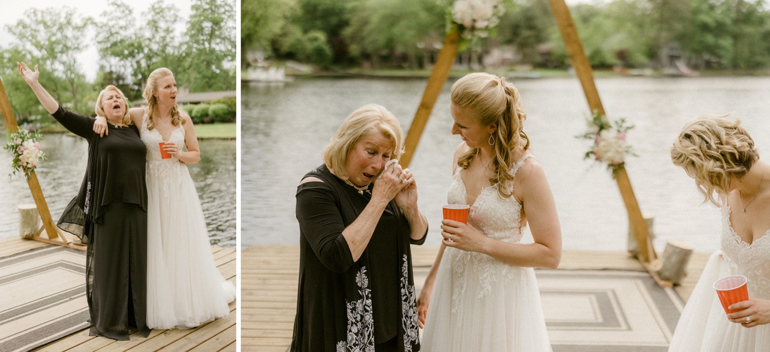 bride hugging mom crying on dock lakeside backyard micro wedding