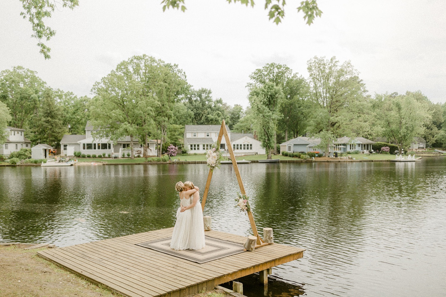 brides first dance on dock lakeside backyard micro wedding
