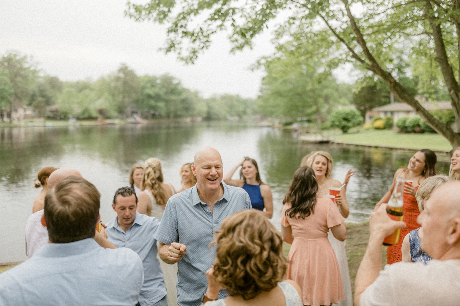 guests dancing at lakeside backyard micro wedding
