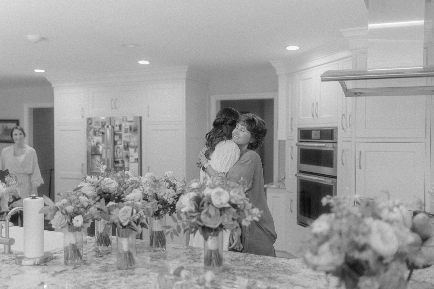 bride and mom hugging getting ready
