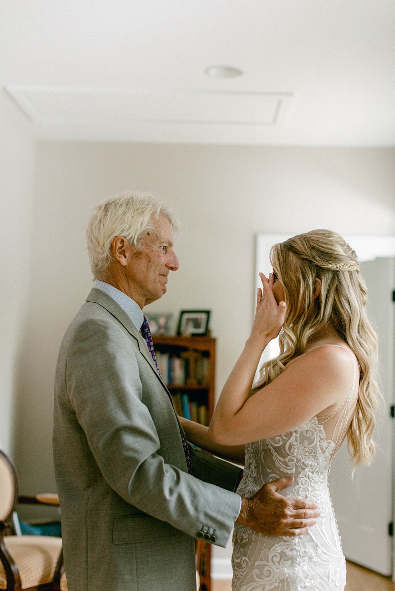 bride and father crying first look