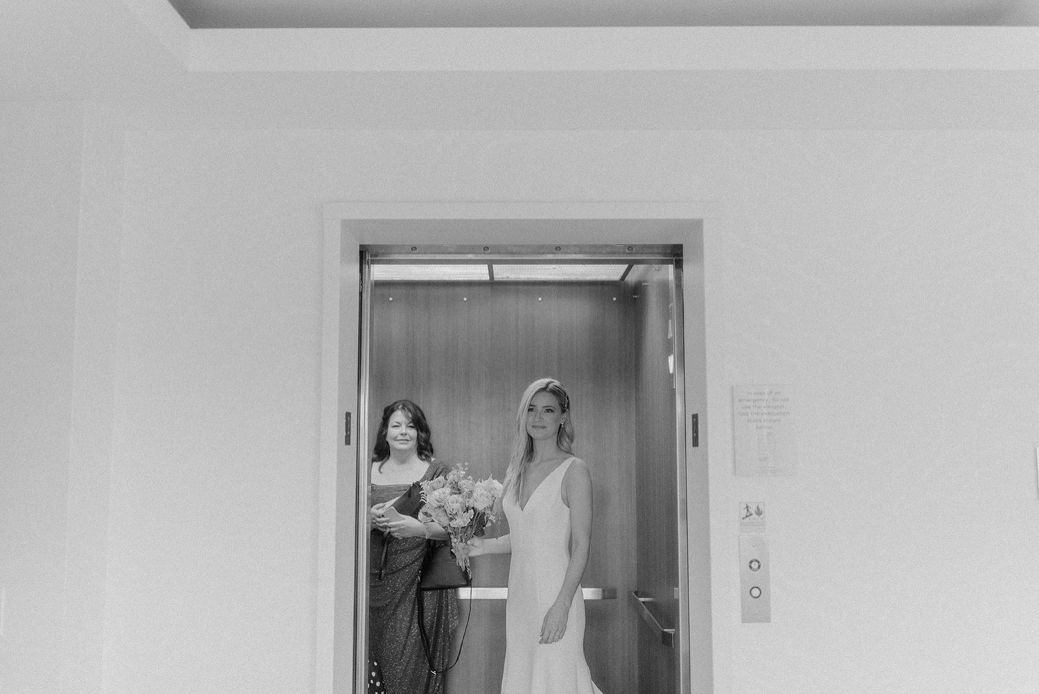bride getting in elevator philadelphia wedding