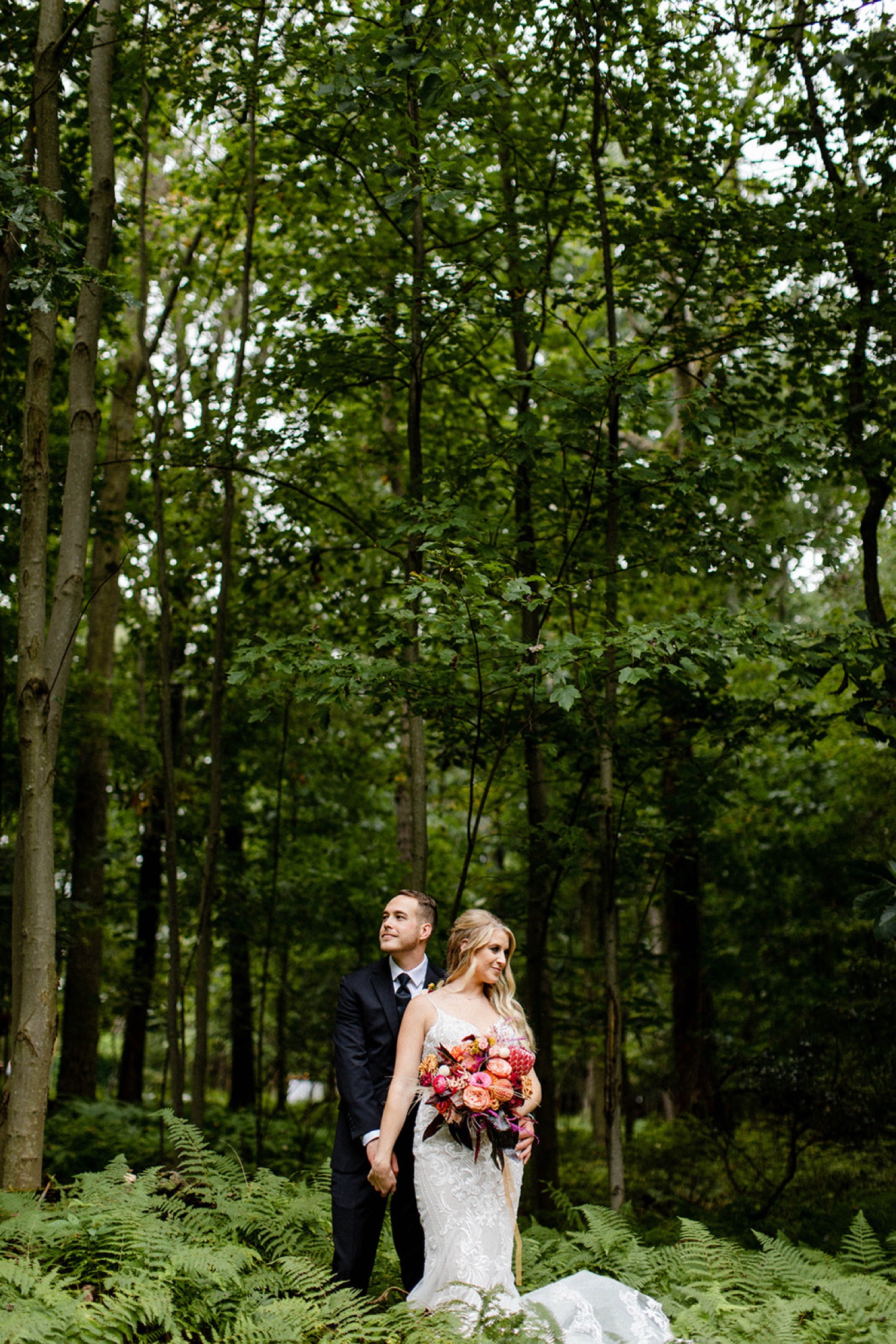bride and groom couples portrait in the forest bohemian backyard wedding