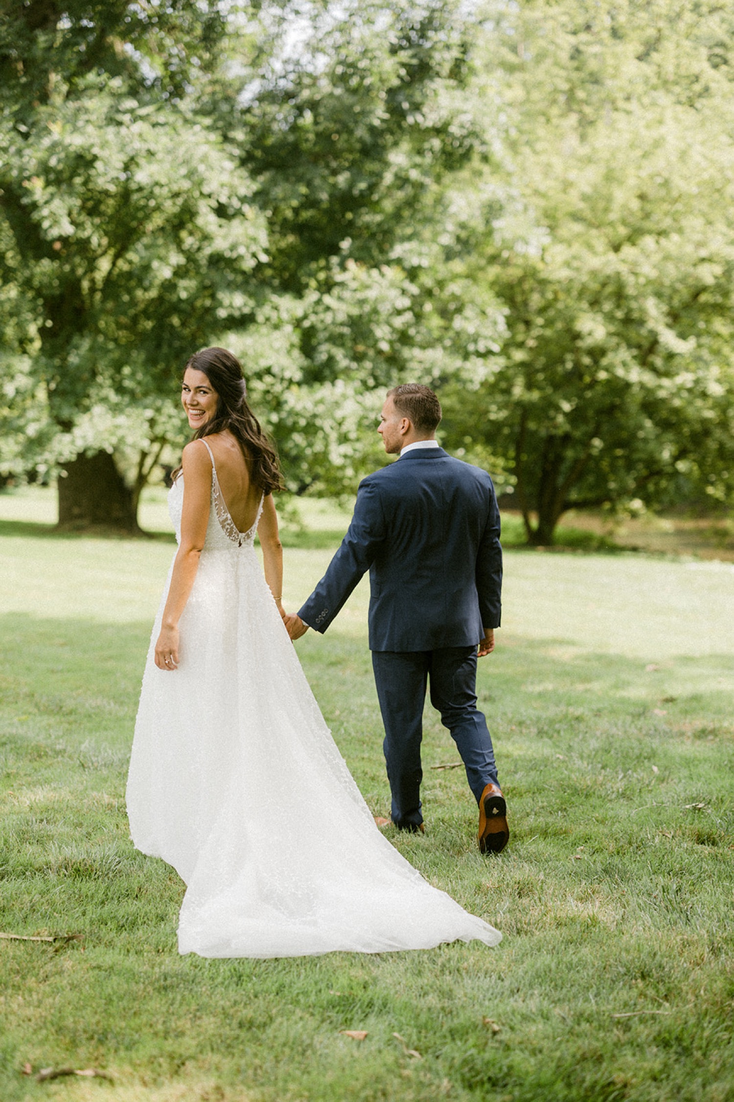 bride and groom holding hands first look dreamy backyard wedding