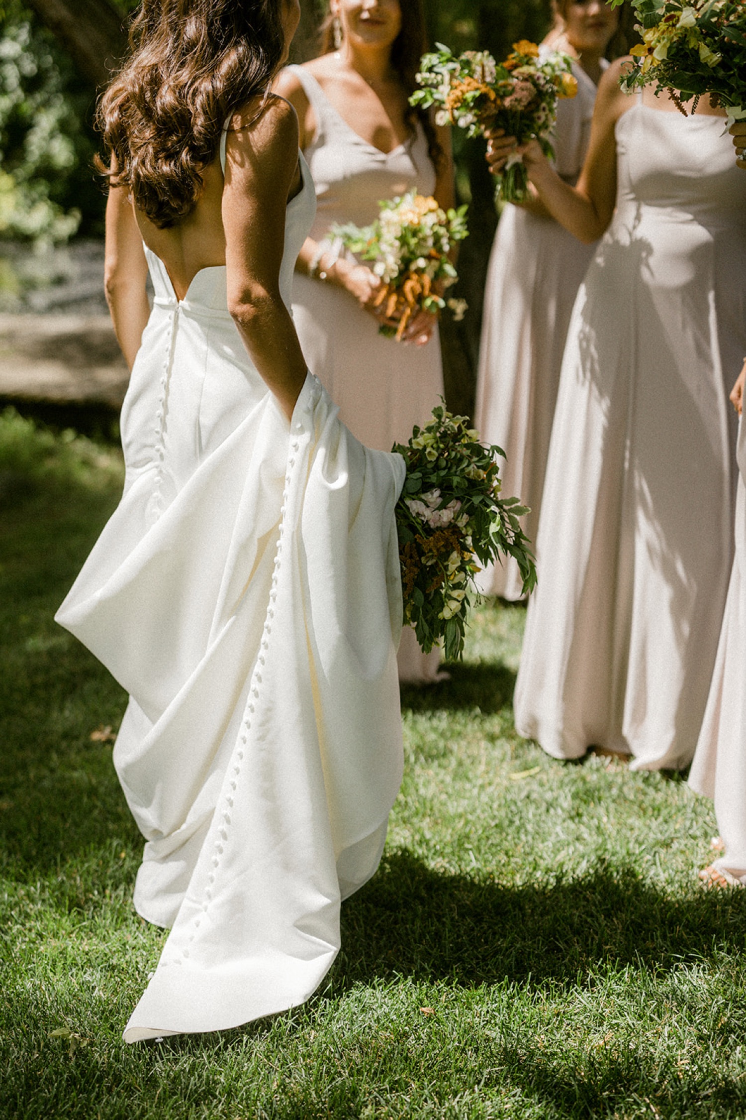 brides and bridesmaids dresses and bouquet