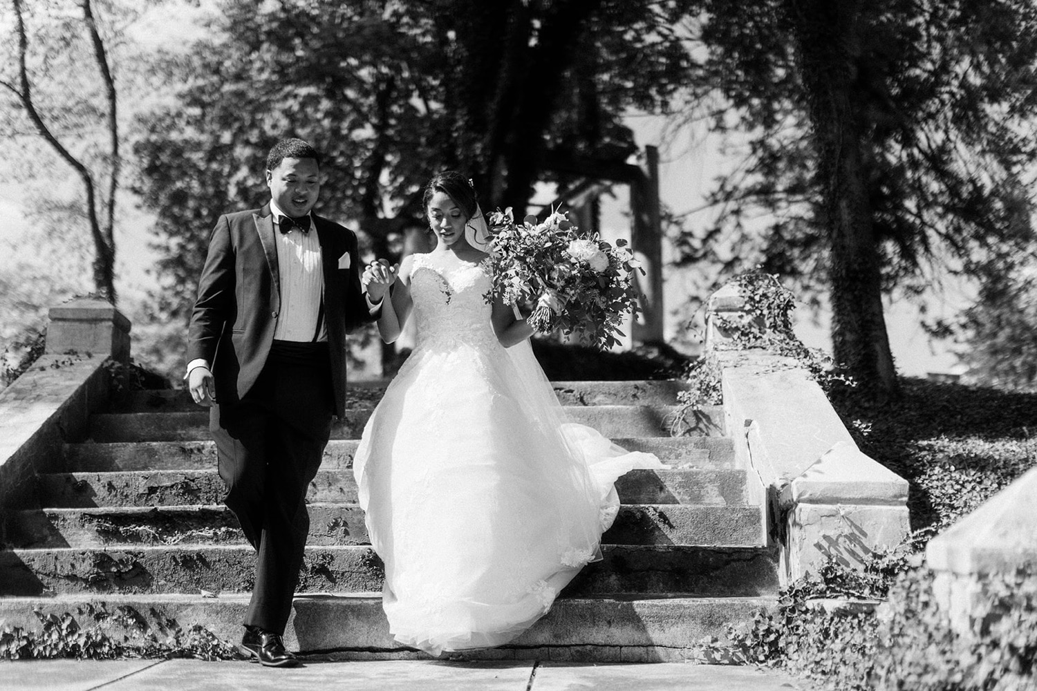 bride and groom running down stairs fairytale wedding at historic shady lane