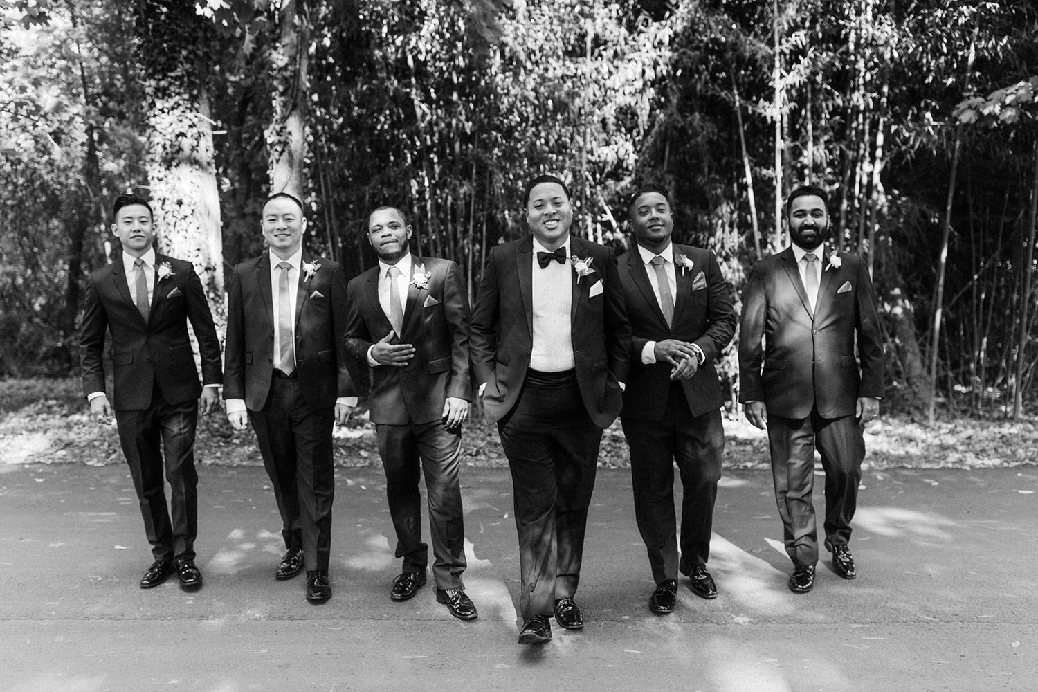 groom and groomsmen walking wedding party