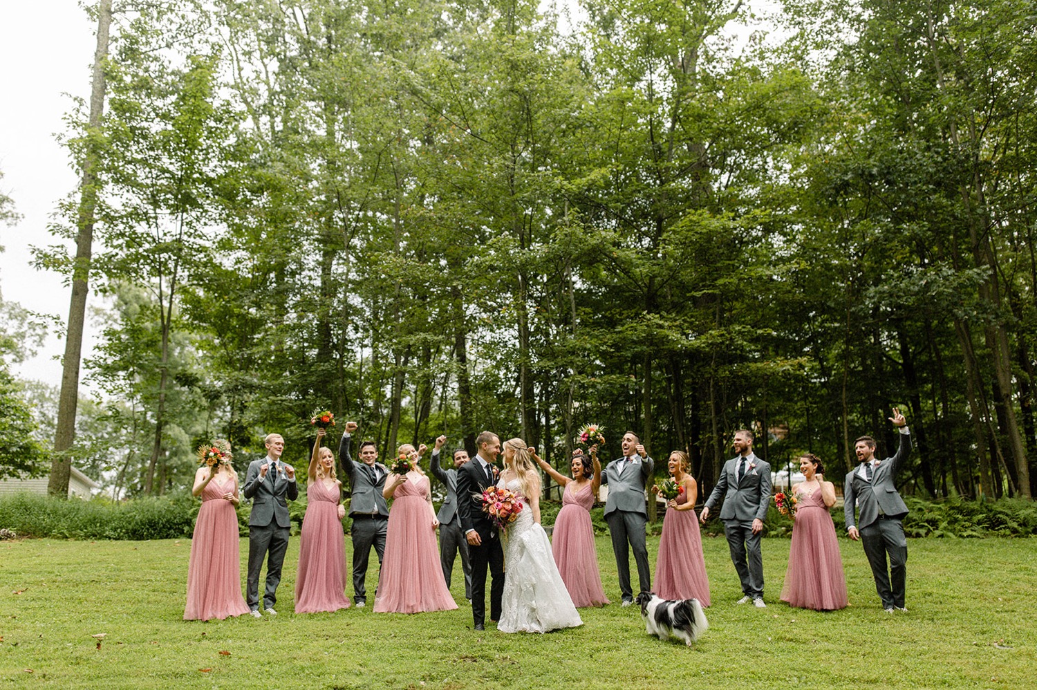 wedding party cheering forest