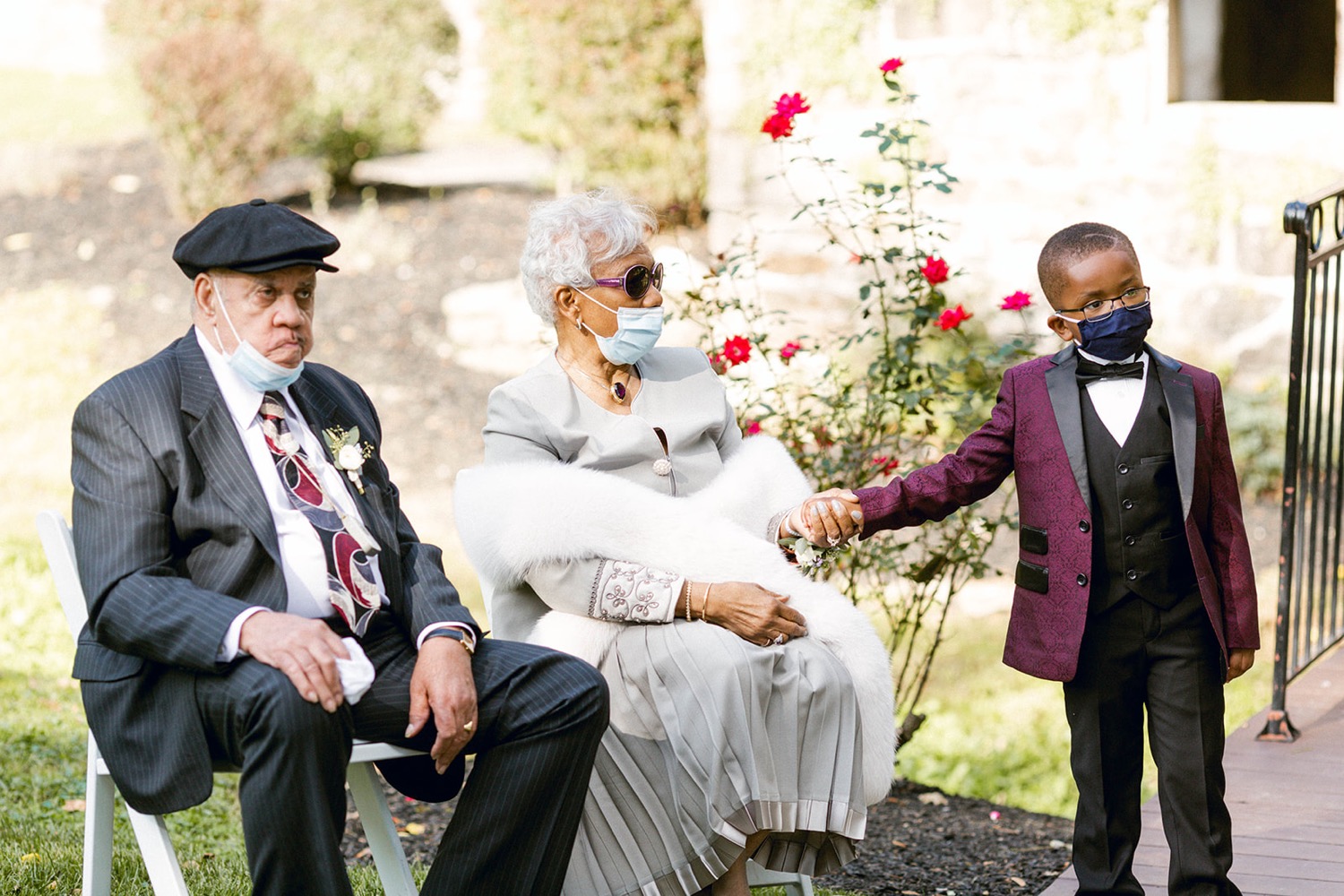 elderly couple sitting at wedding ceremony