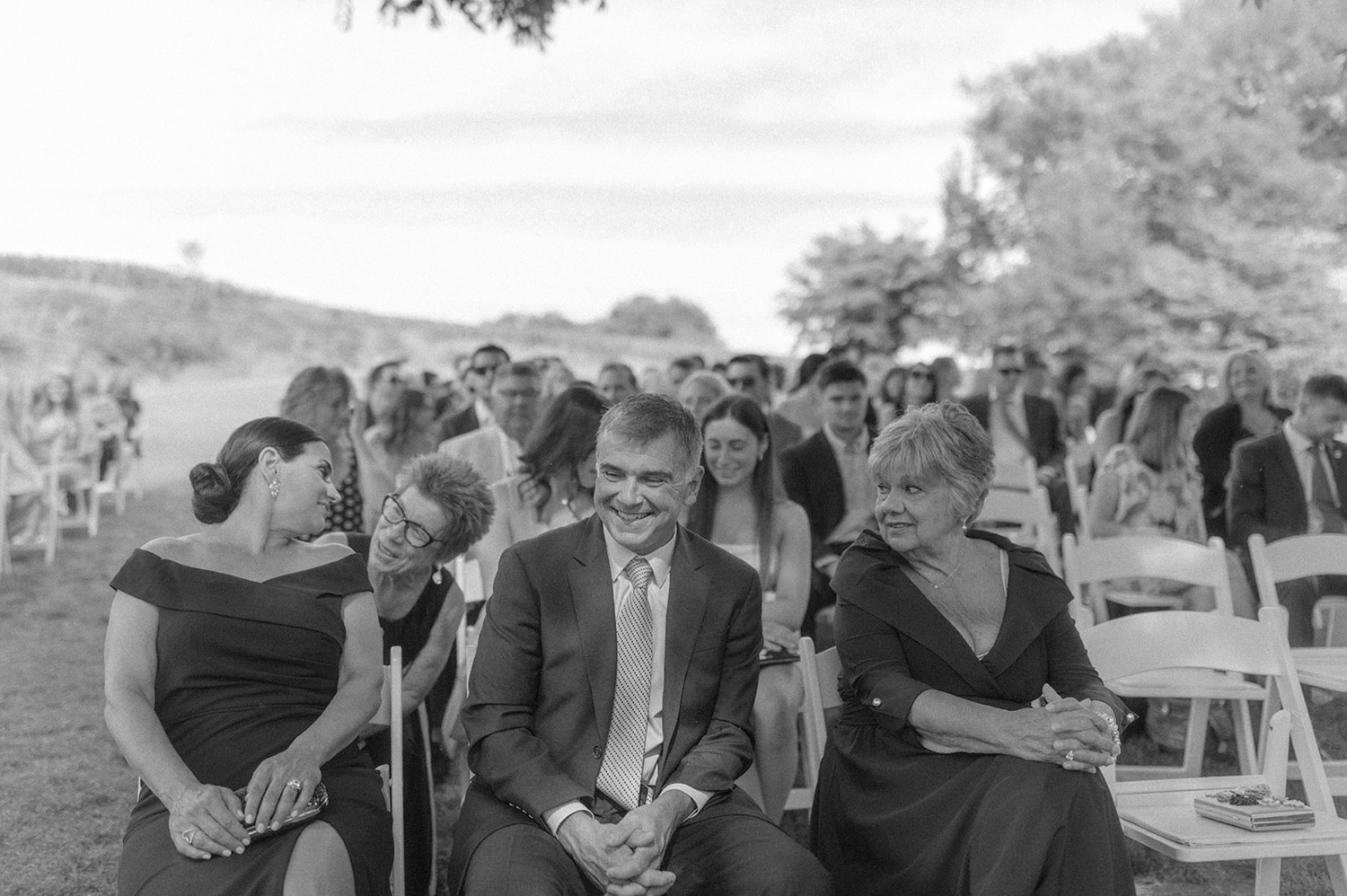 guests laughing at wedding ceremony