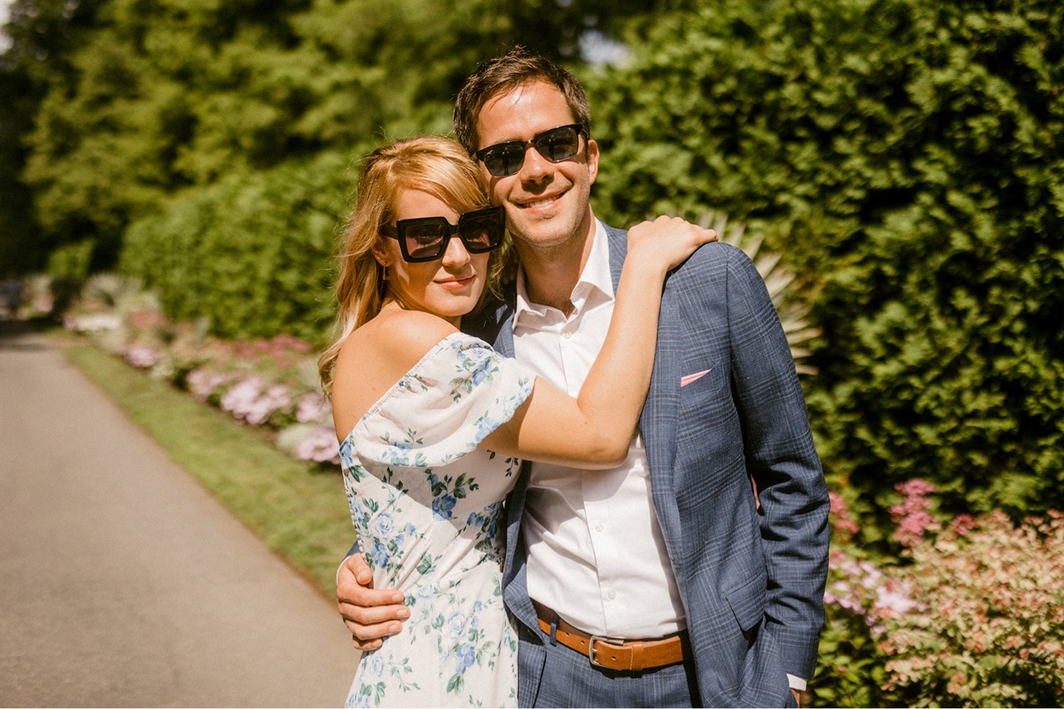 longwood gardens couple wearing sunglasses hugging