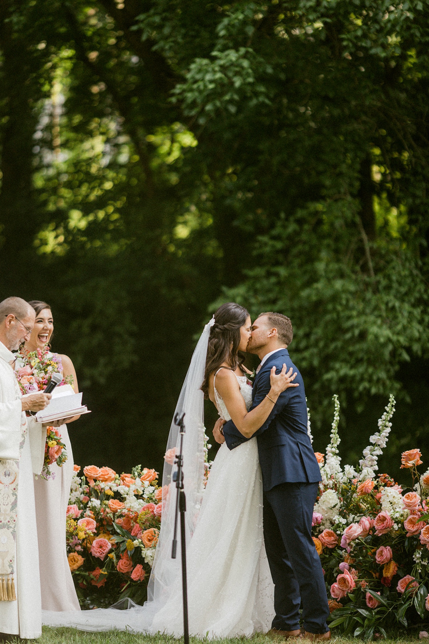 bride and groom kissing wedding ceremony dreamy backyard wedding