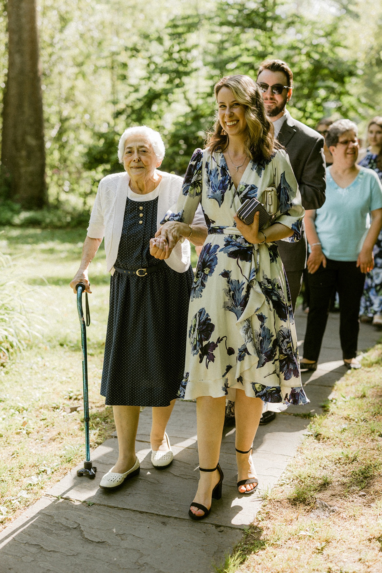 guests entering wedding ceremony grandma holding hands