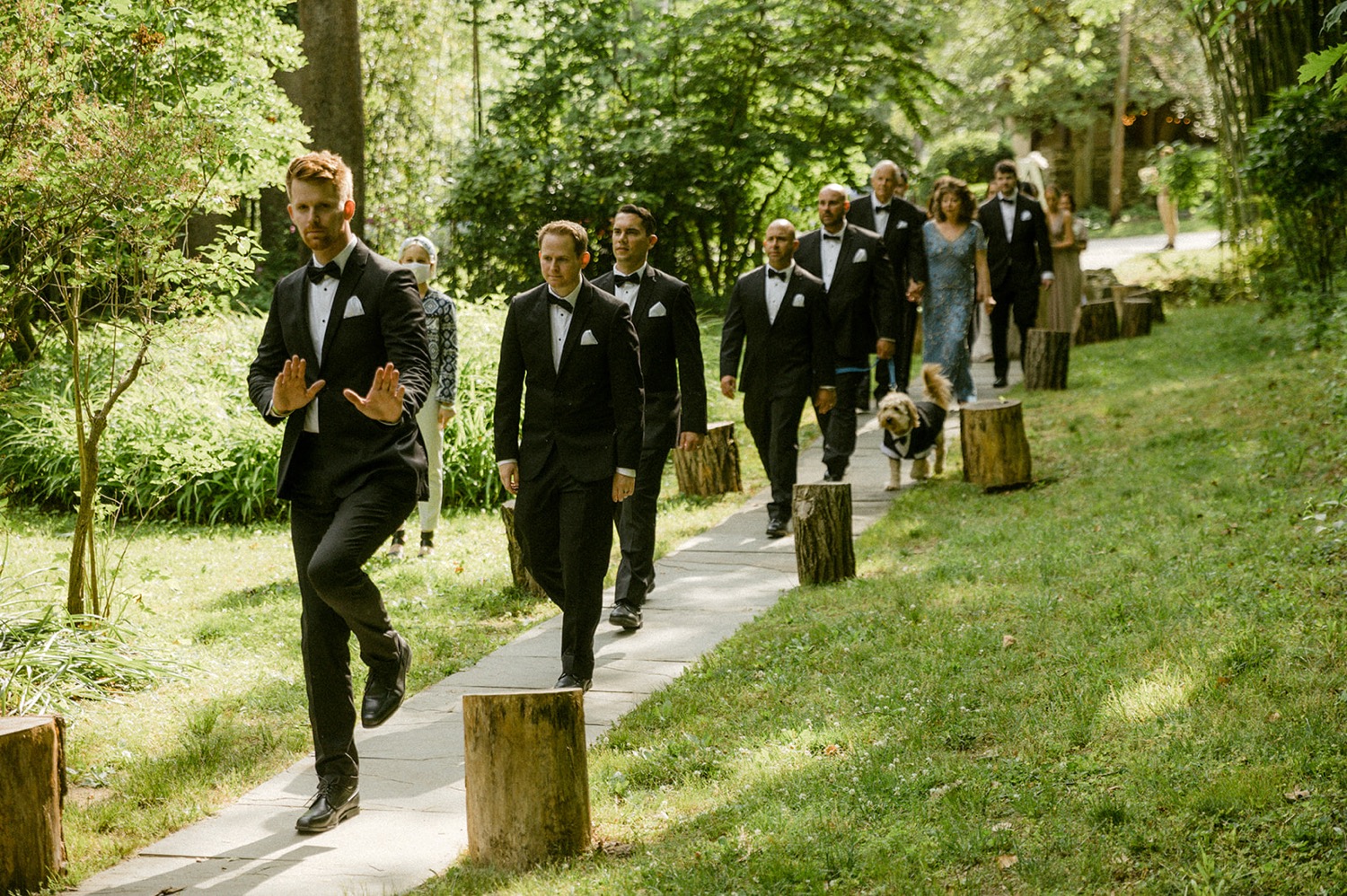 groomsmen entering wedding reception outdoor the old mill