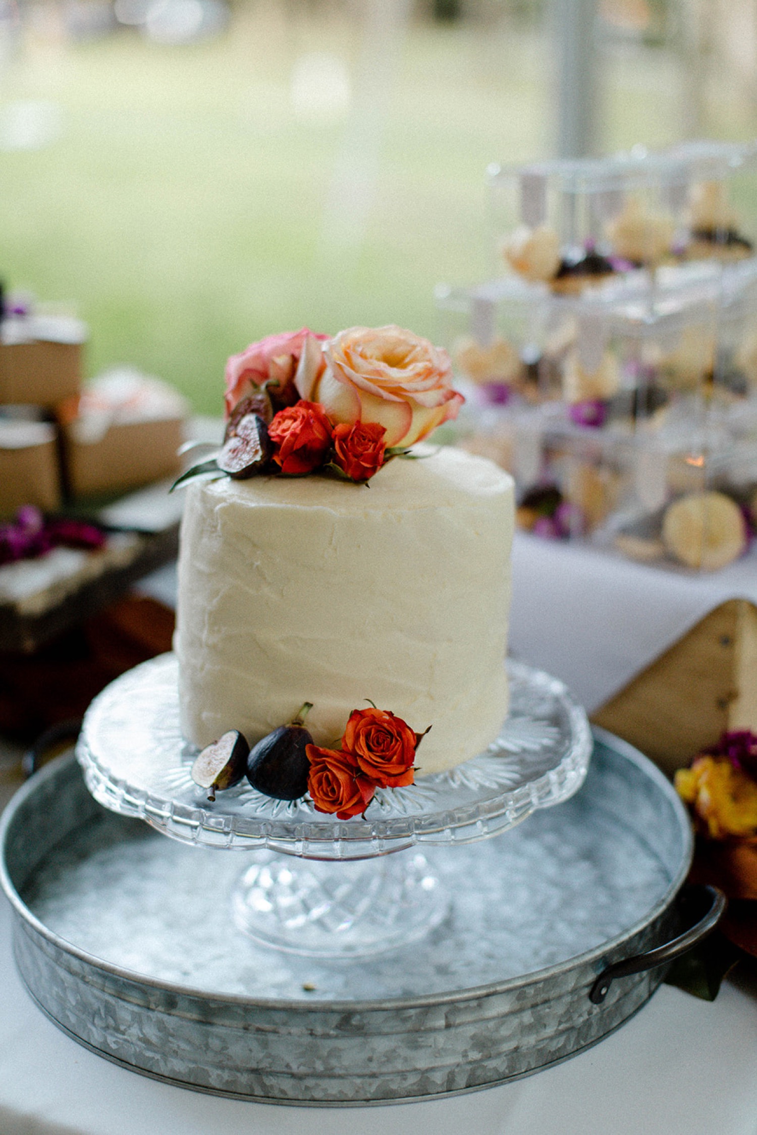 colorful flowers on white wedding cake bohemian