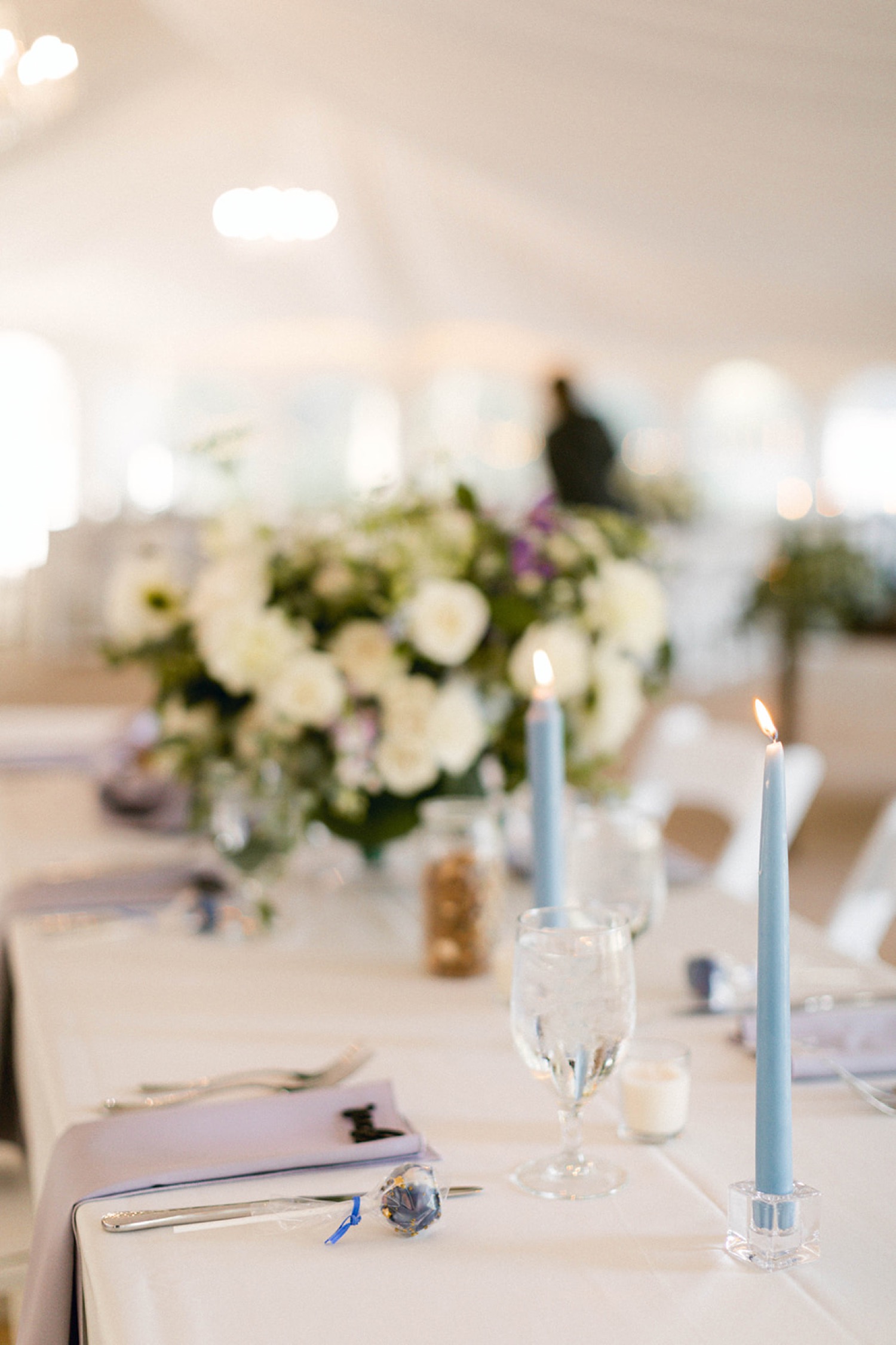 blue candles wedding reception table details