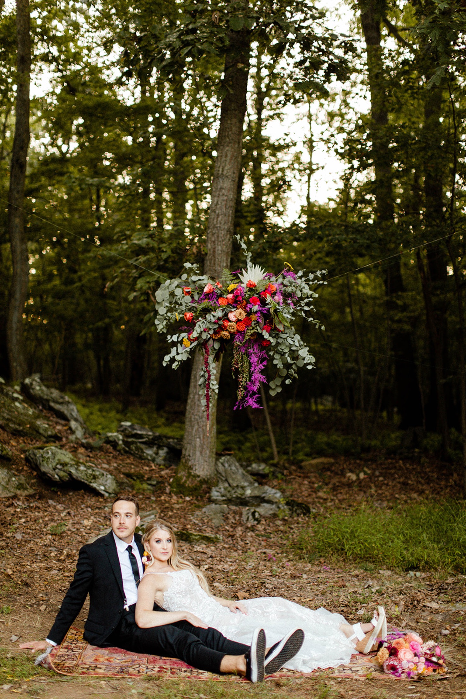 bride and groom evening portrait colorful bohemian backyard wedding