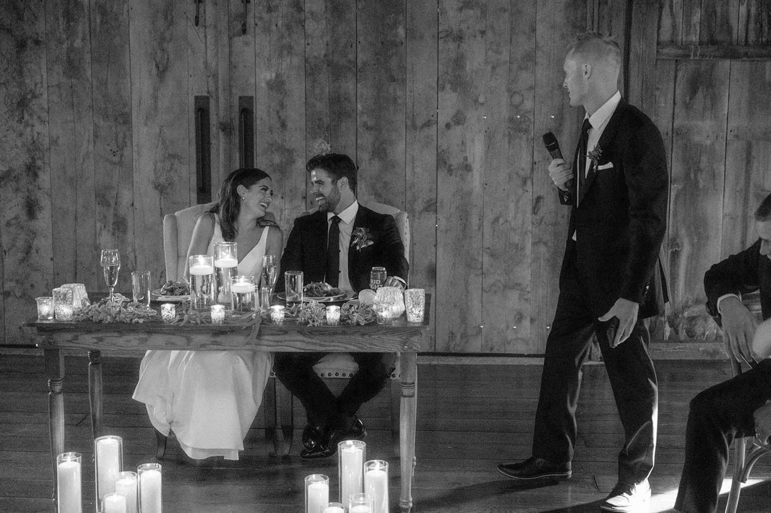 couple looking at each other during wedding toast