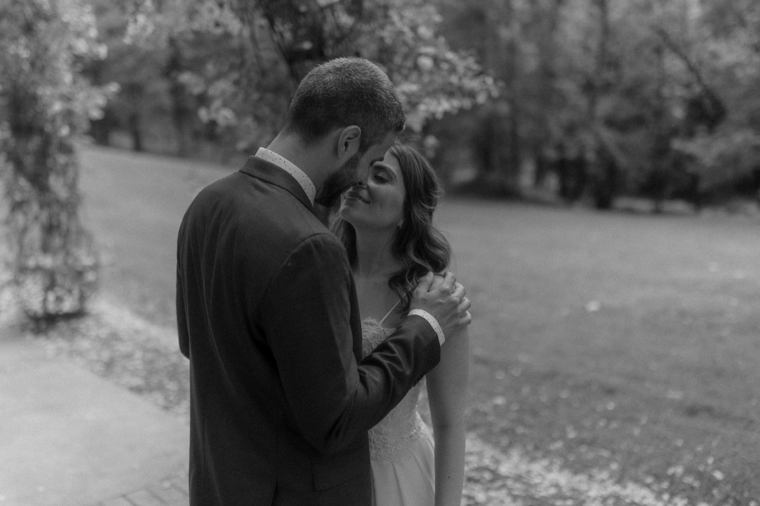 black and white photo couple kissing wedding
