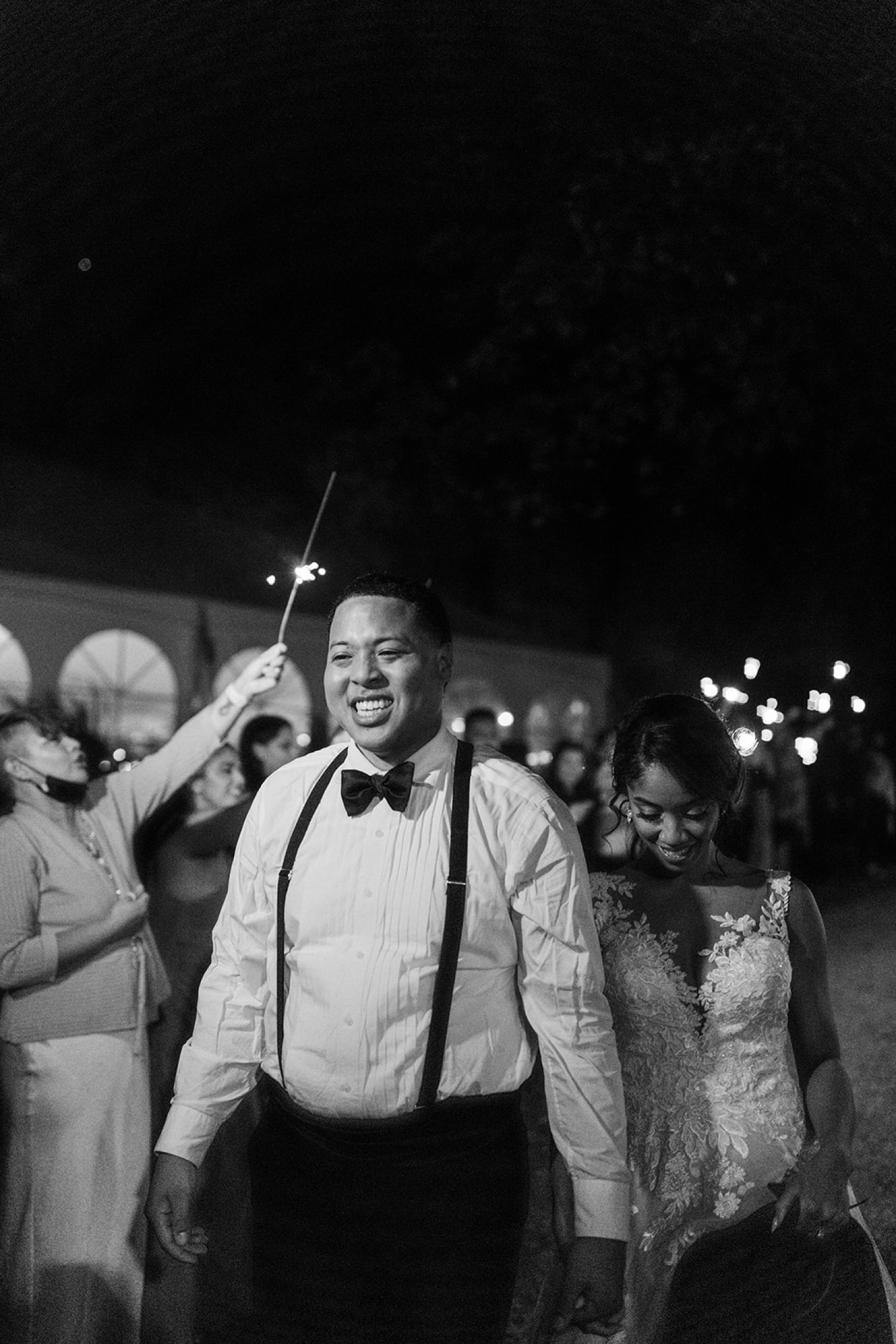 bride and groom walking at night sparkler send off