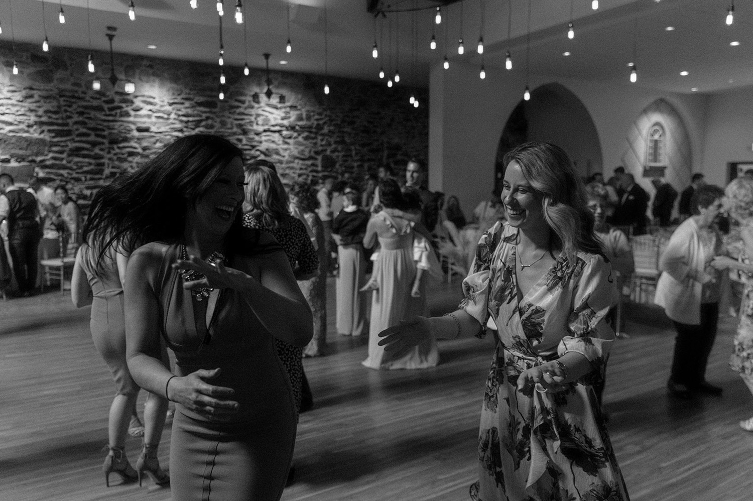 guests dancing crazy at wedding reception