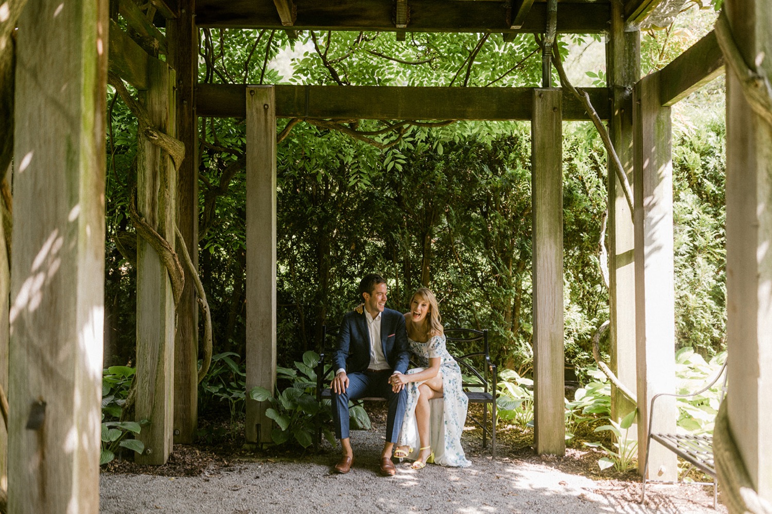 couple under arbor at longwood gardens