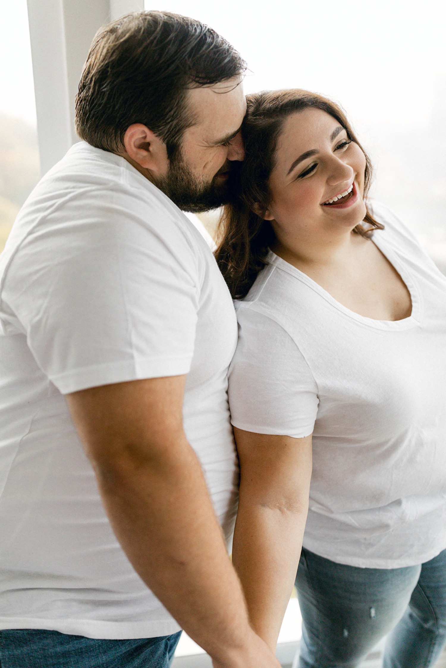 couple white tshirts jeans engagement session