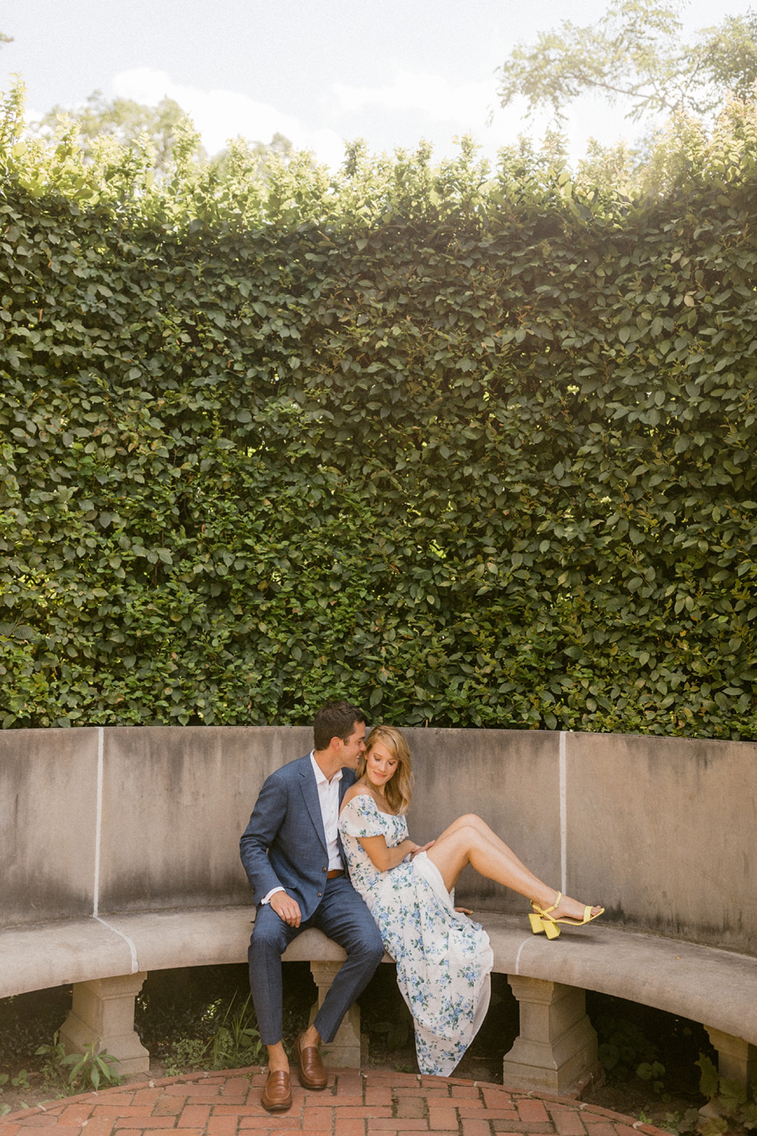 couple in front of vine wall at longwood gardens