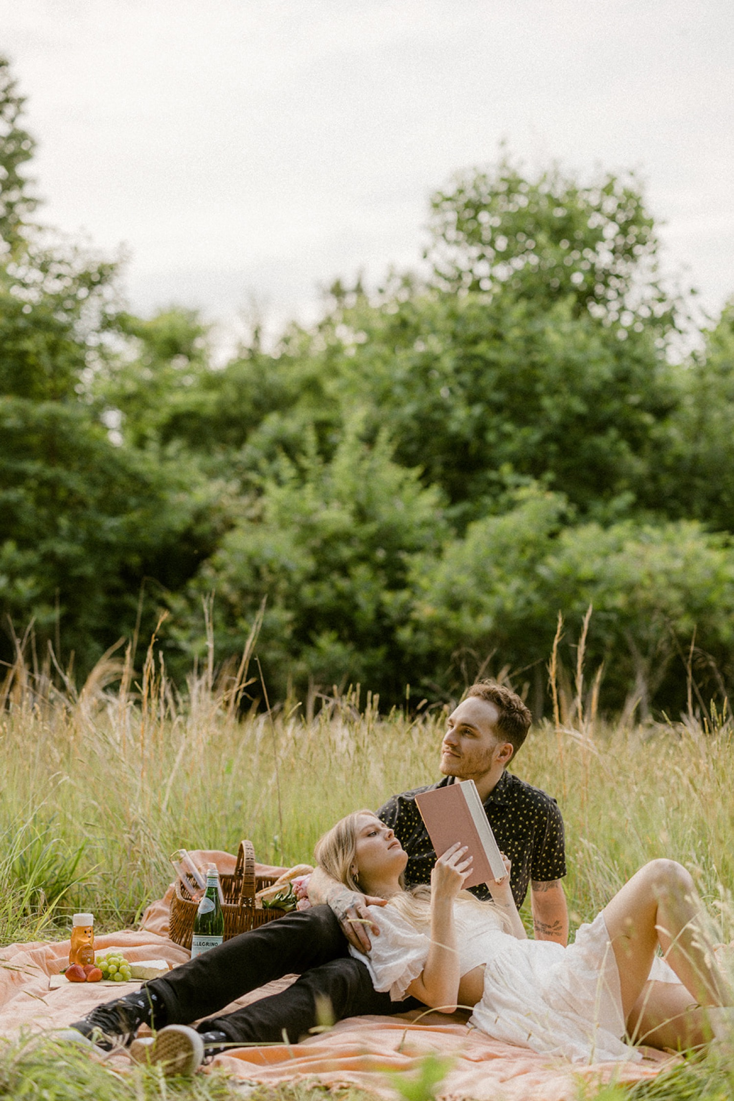 reading a book bohemian picnic engagement session