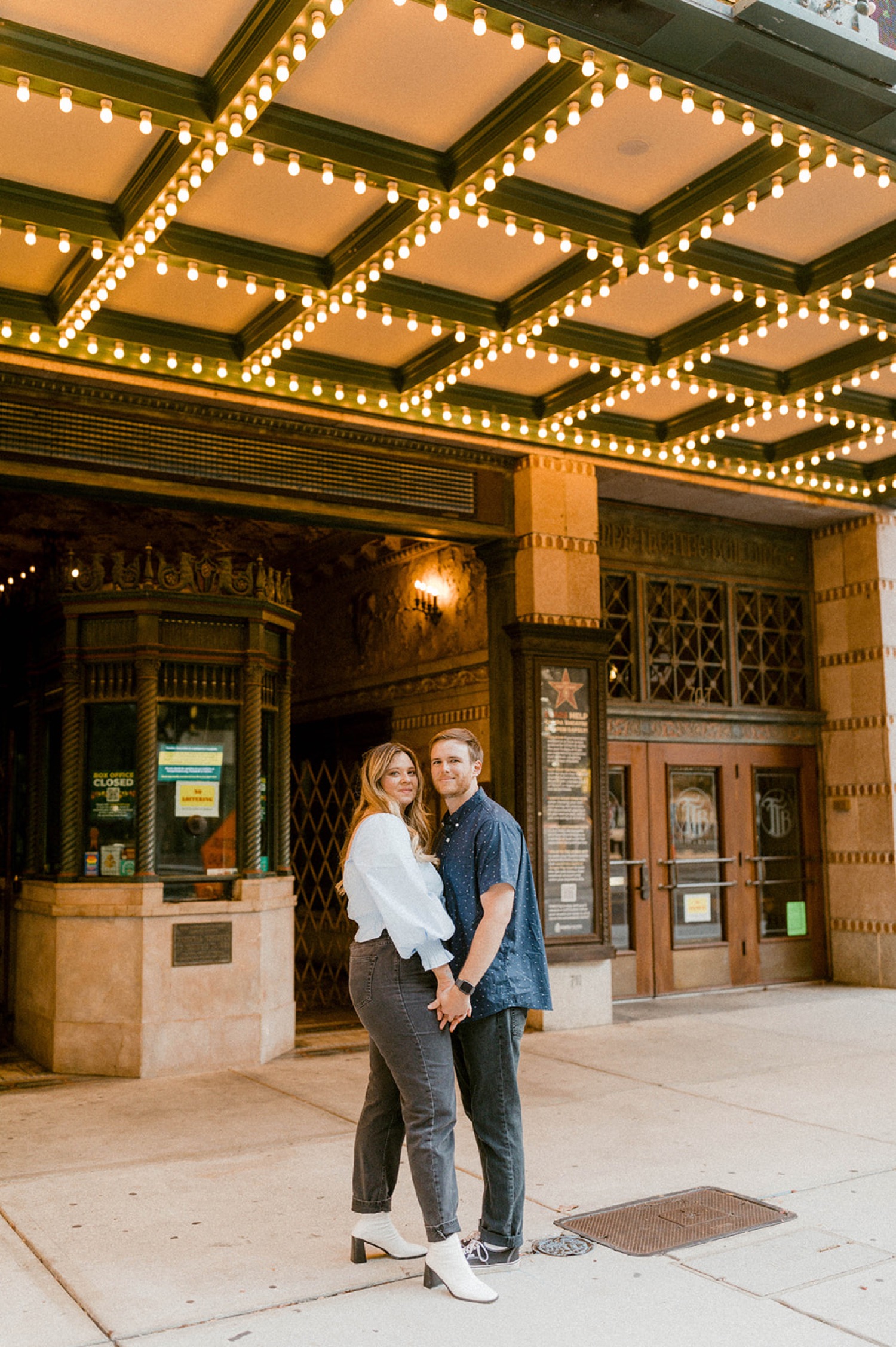 sophisticated couple in front of tampa theater