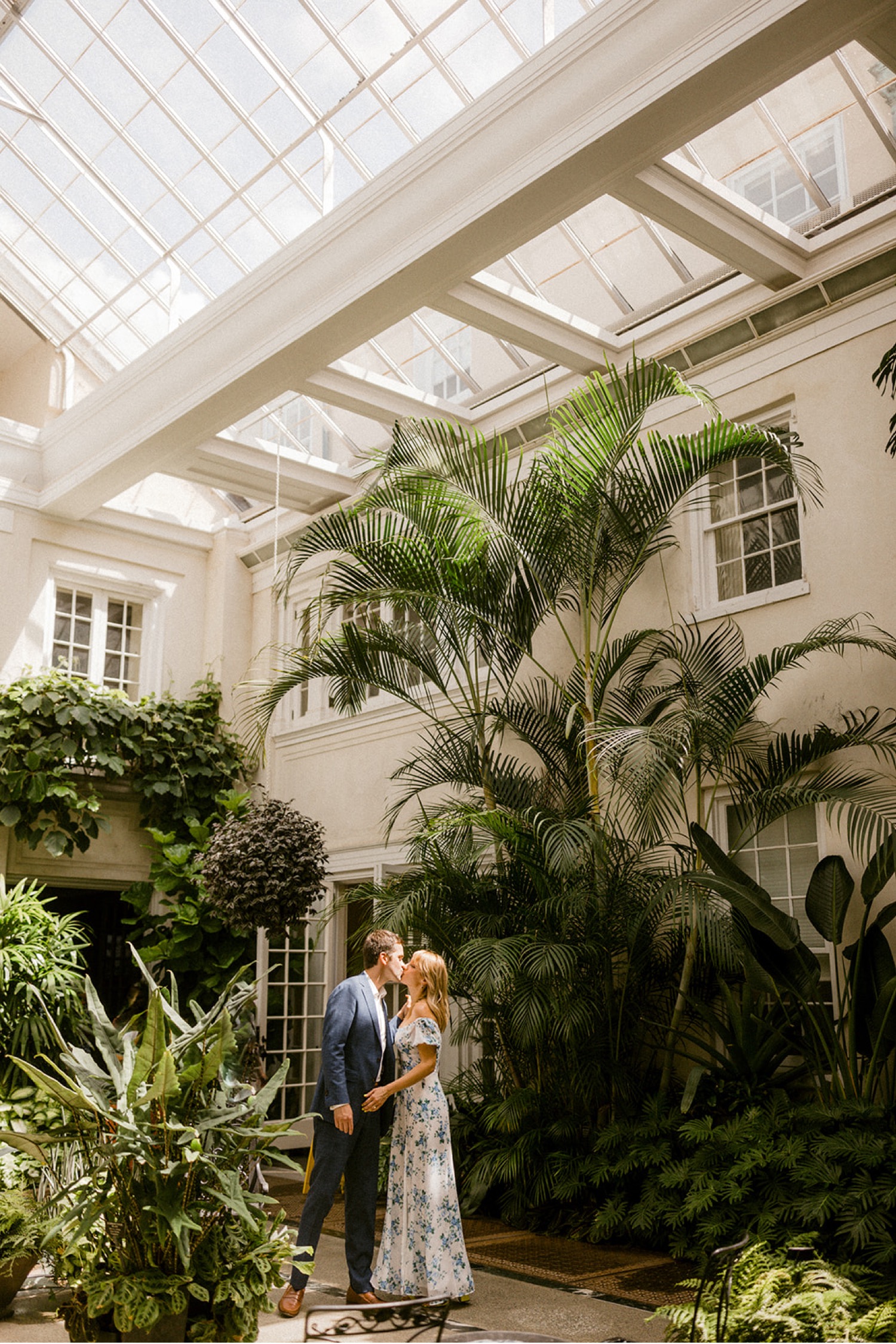 couple kissing in greenhouse longwood gardens engagement session
