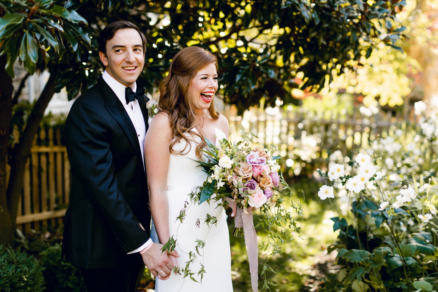 bride and groom laughing portraits luxurious backyard wedding