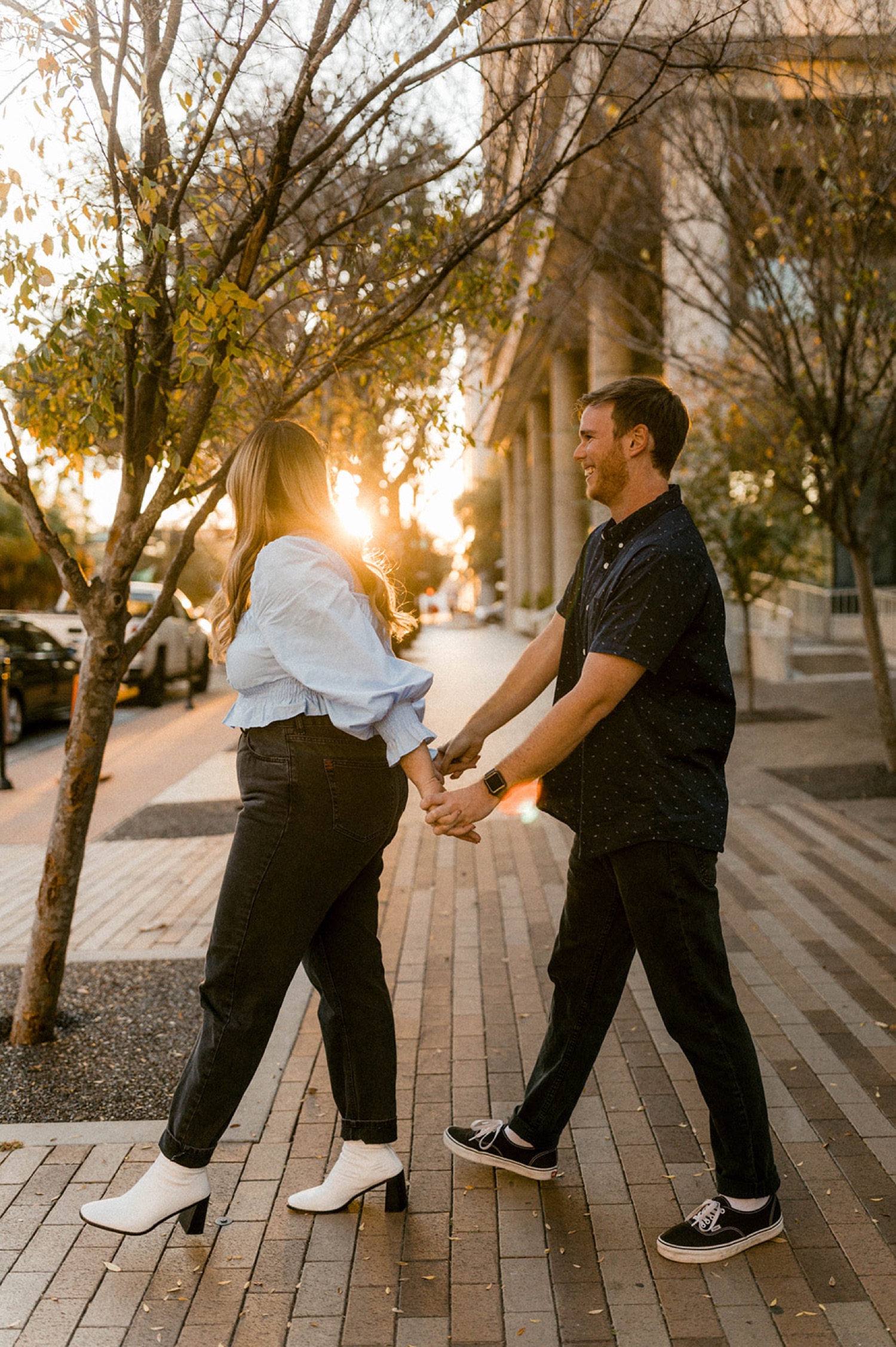 couple walking in downtown tampa engagement