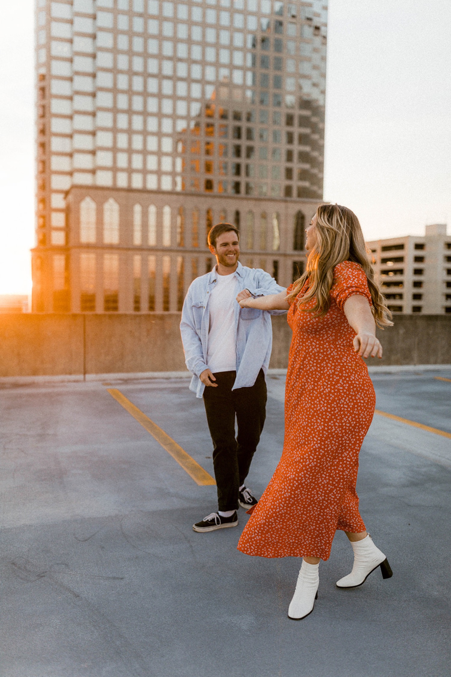 couple dancing on dreamy parking garage rooftop