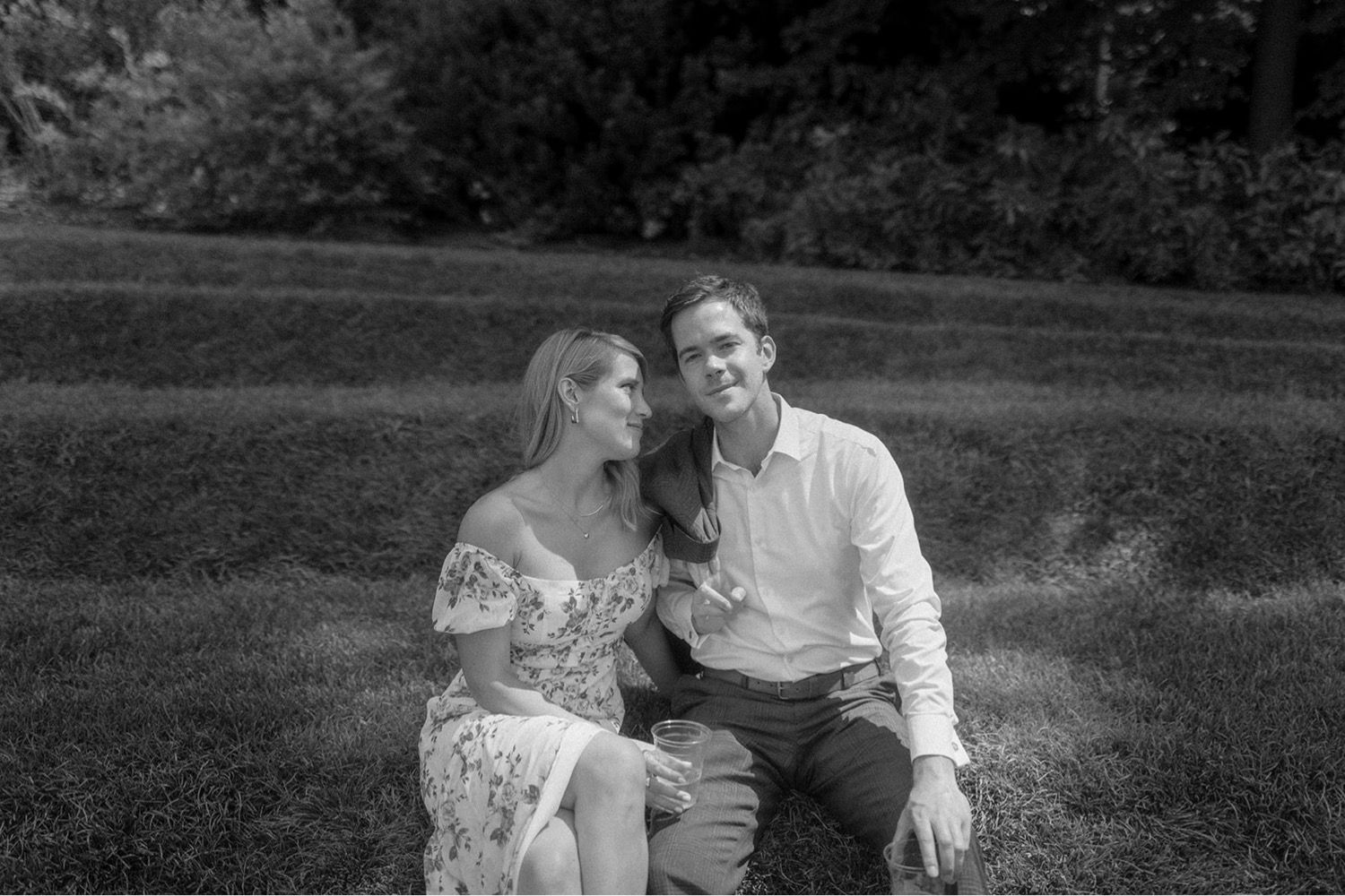couple sitting on lawn at longwood gardens