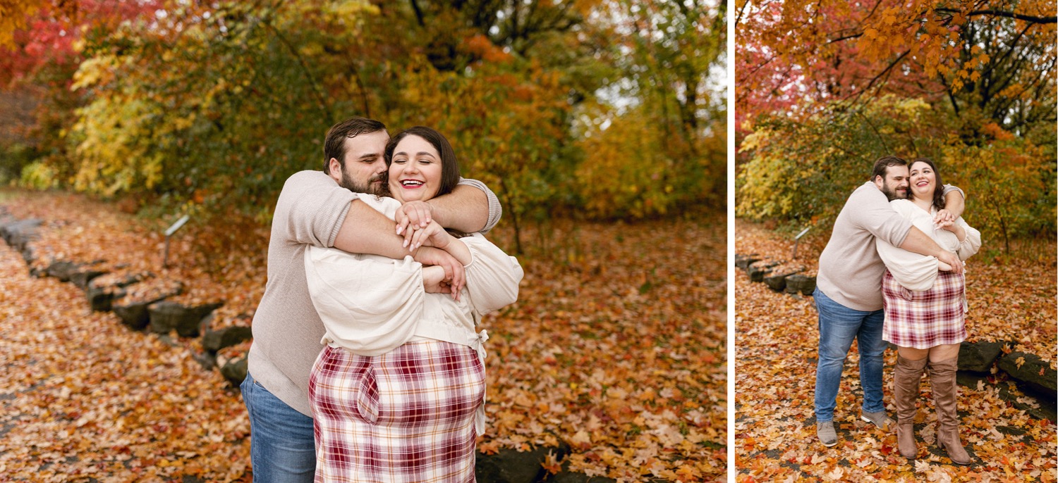 couple hugging fall colorful leaves