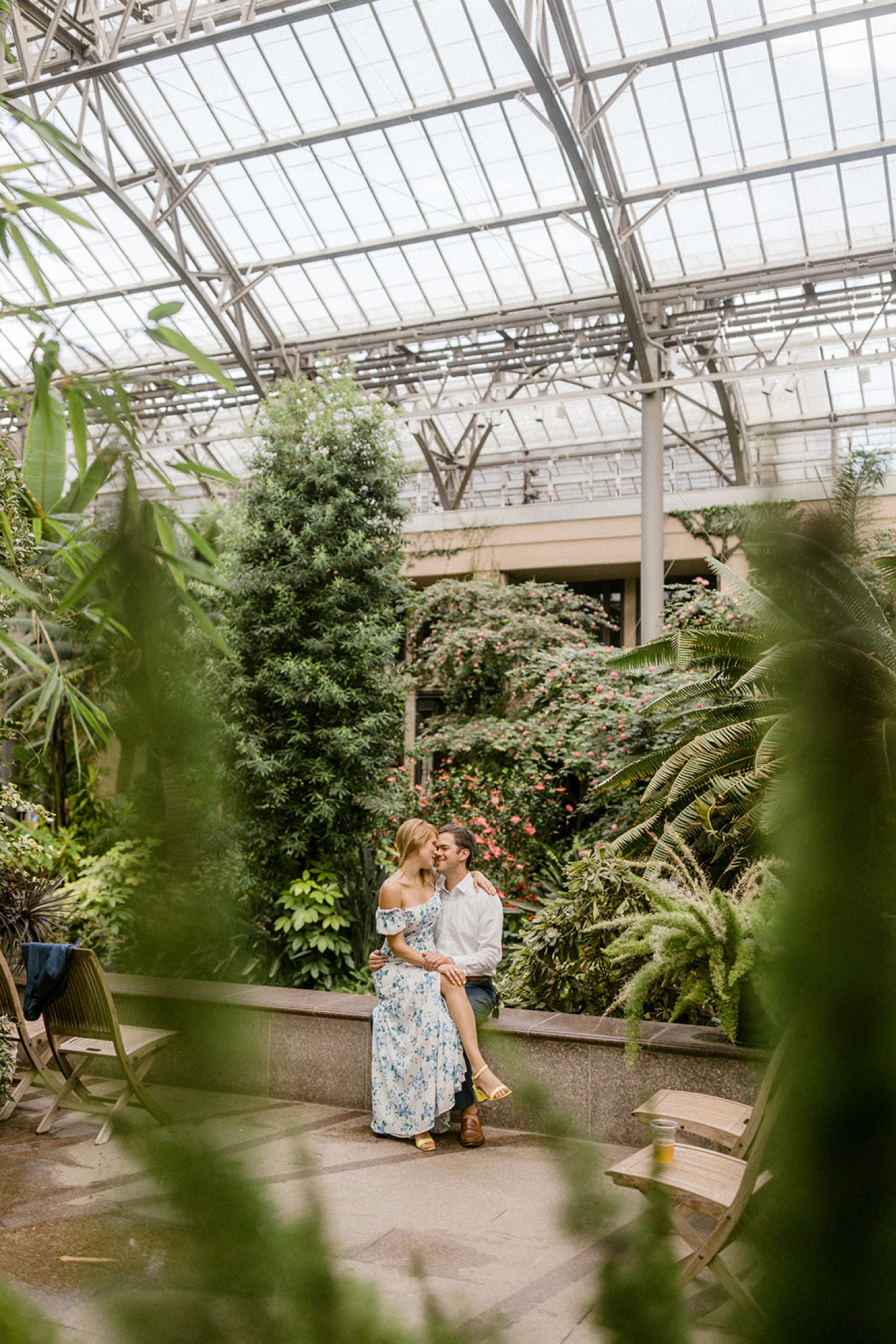 couple kissing in greenhouse longwood gardens engagement session