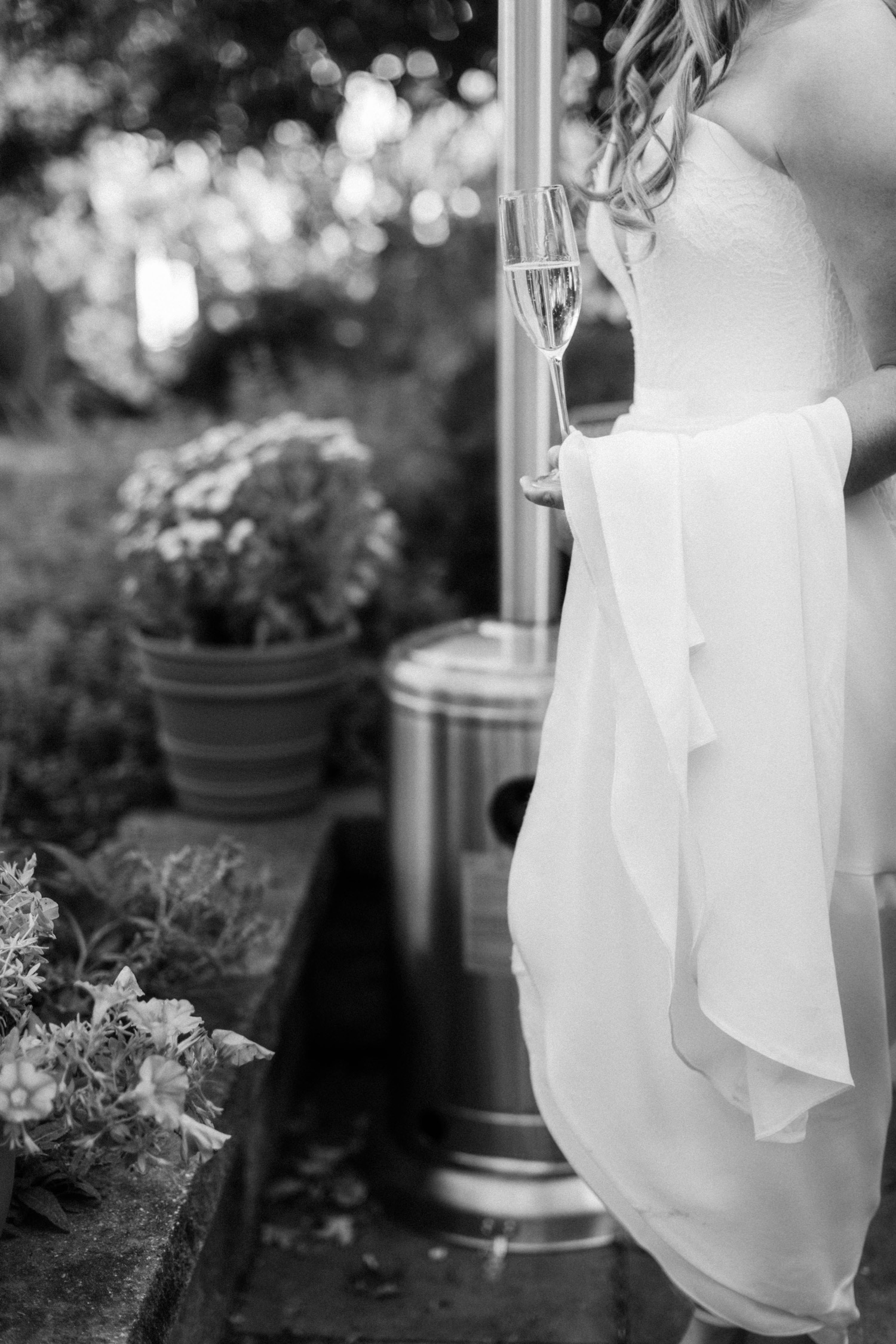 bride holding champagne flute cocktail hour