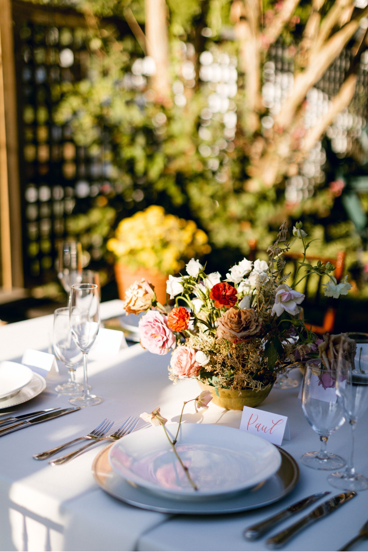 shadowy floral arrangement luxurious backyard wedding